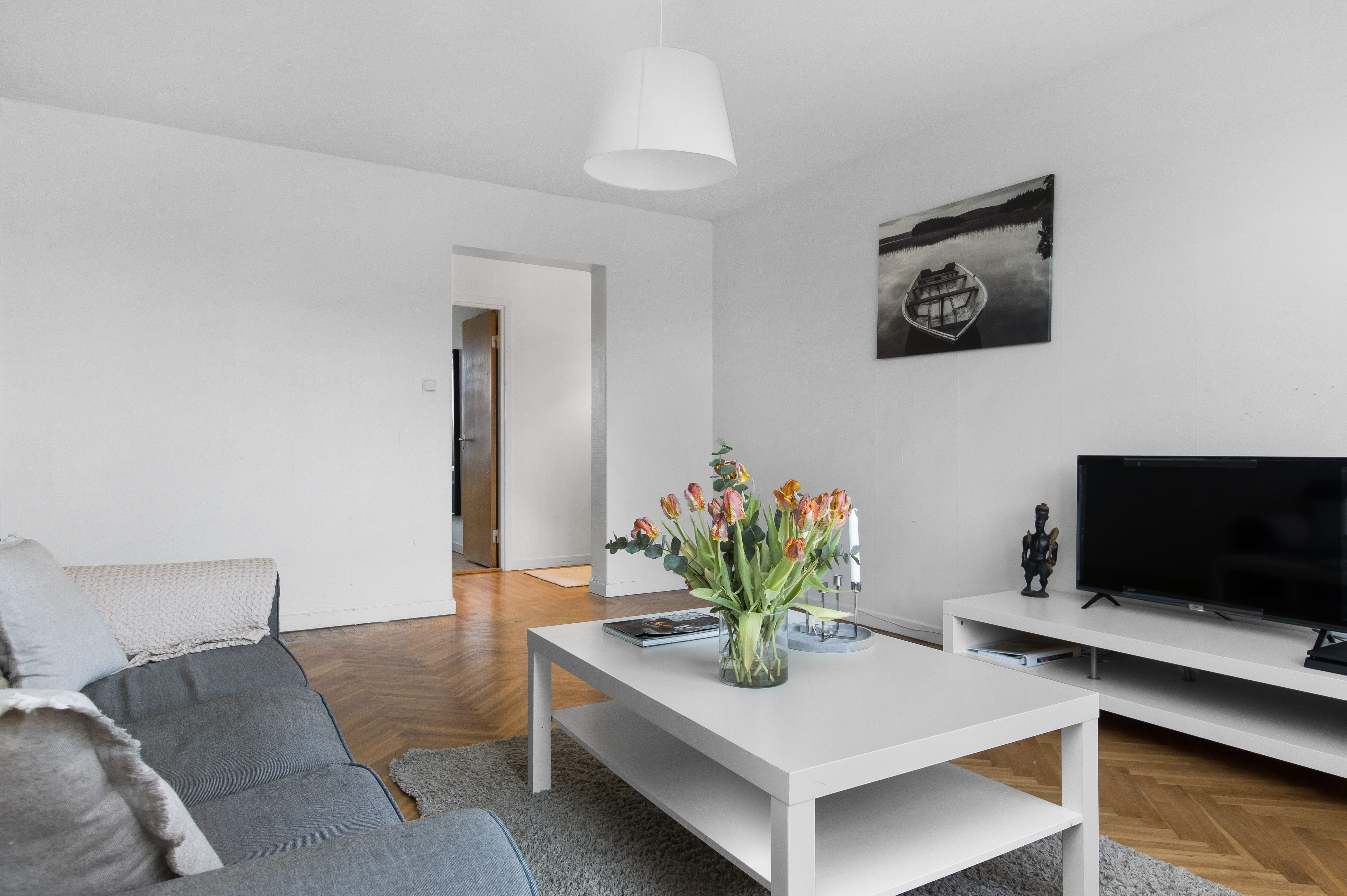 A living room filled with furniture and a flat screen tv