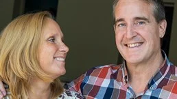 A man and a woman standing in a room