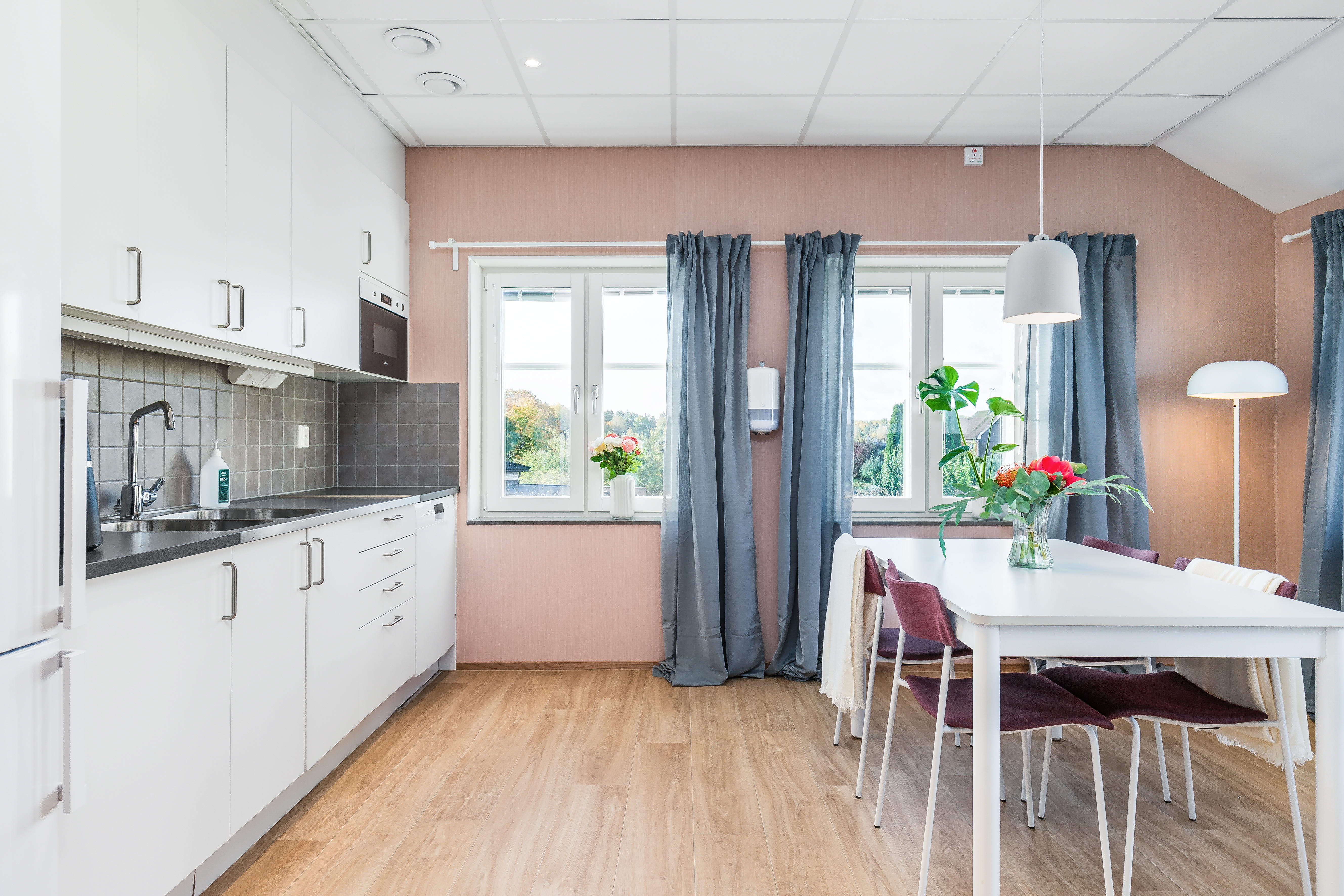 A kitchen with a wood floor