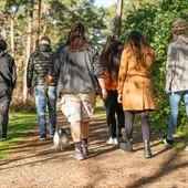 A group of people walking on a path