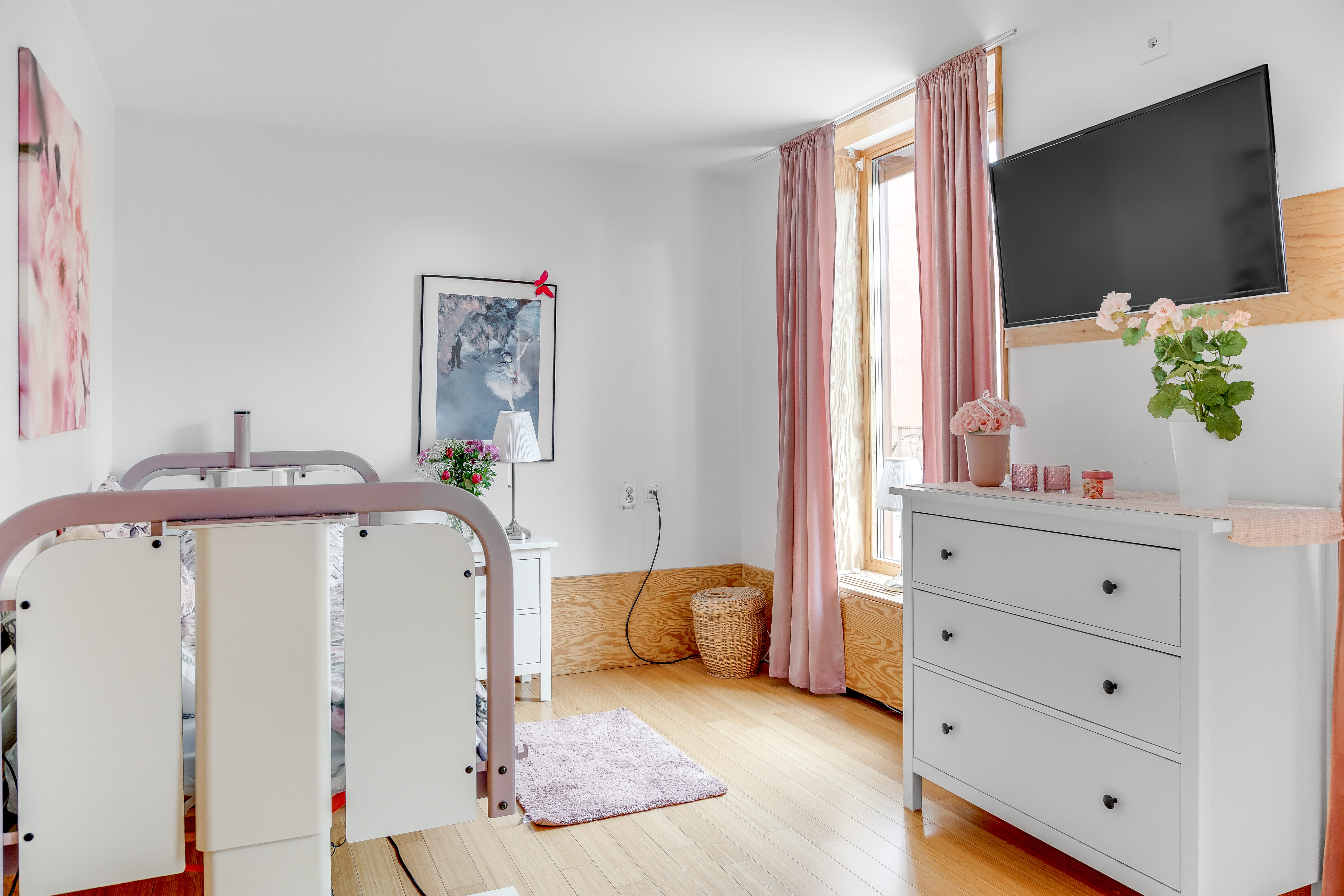 A bedroom with a bed in a room