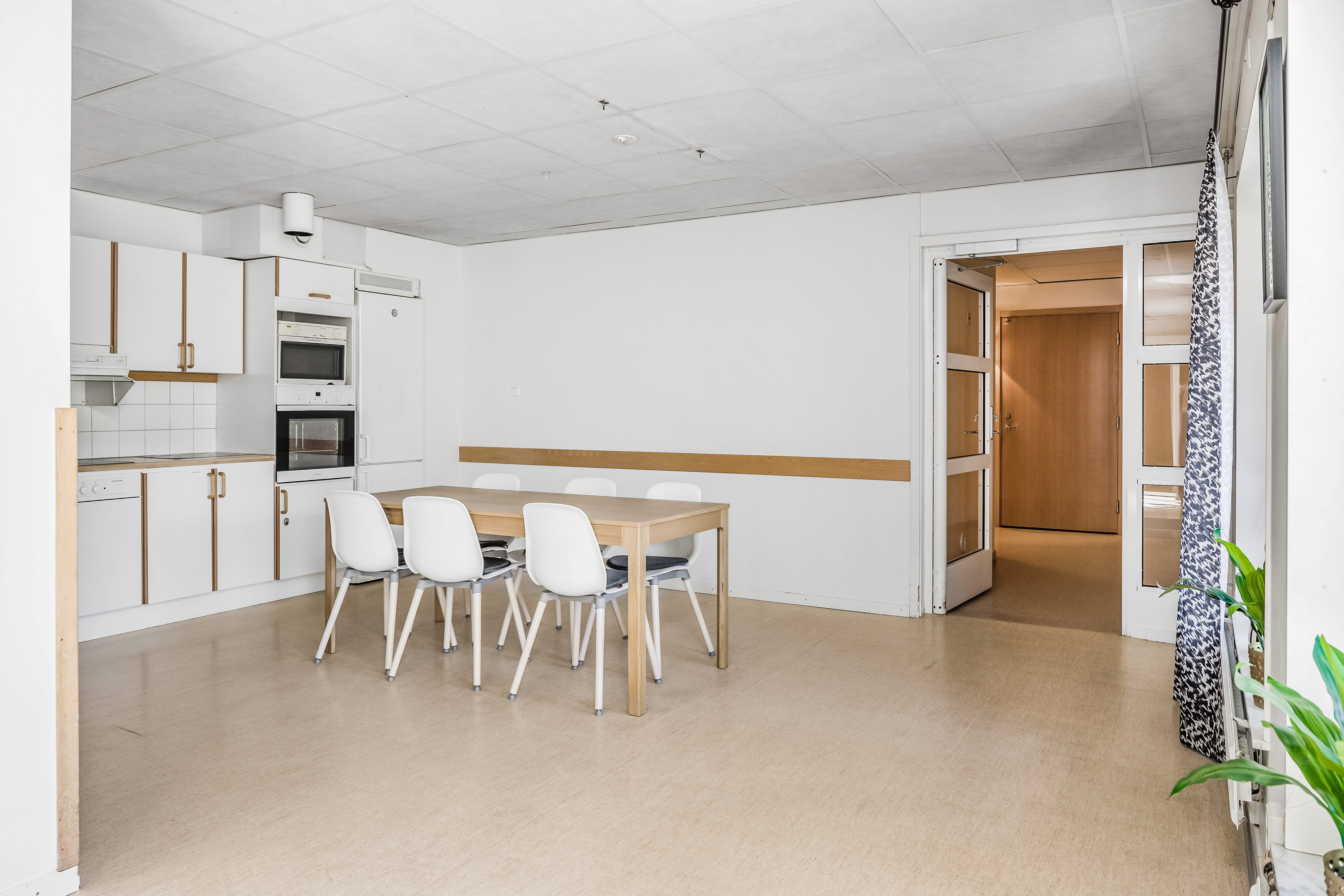 A room filled with furniture on top of a hard wood floor