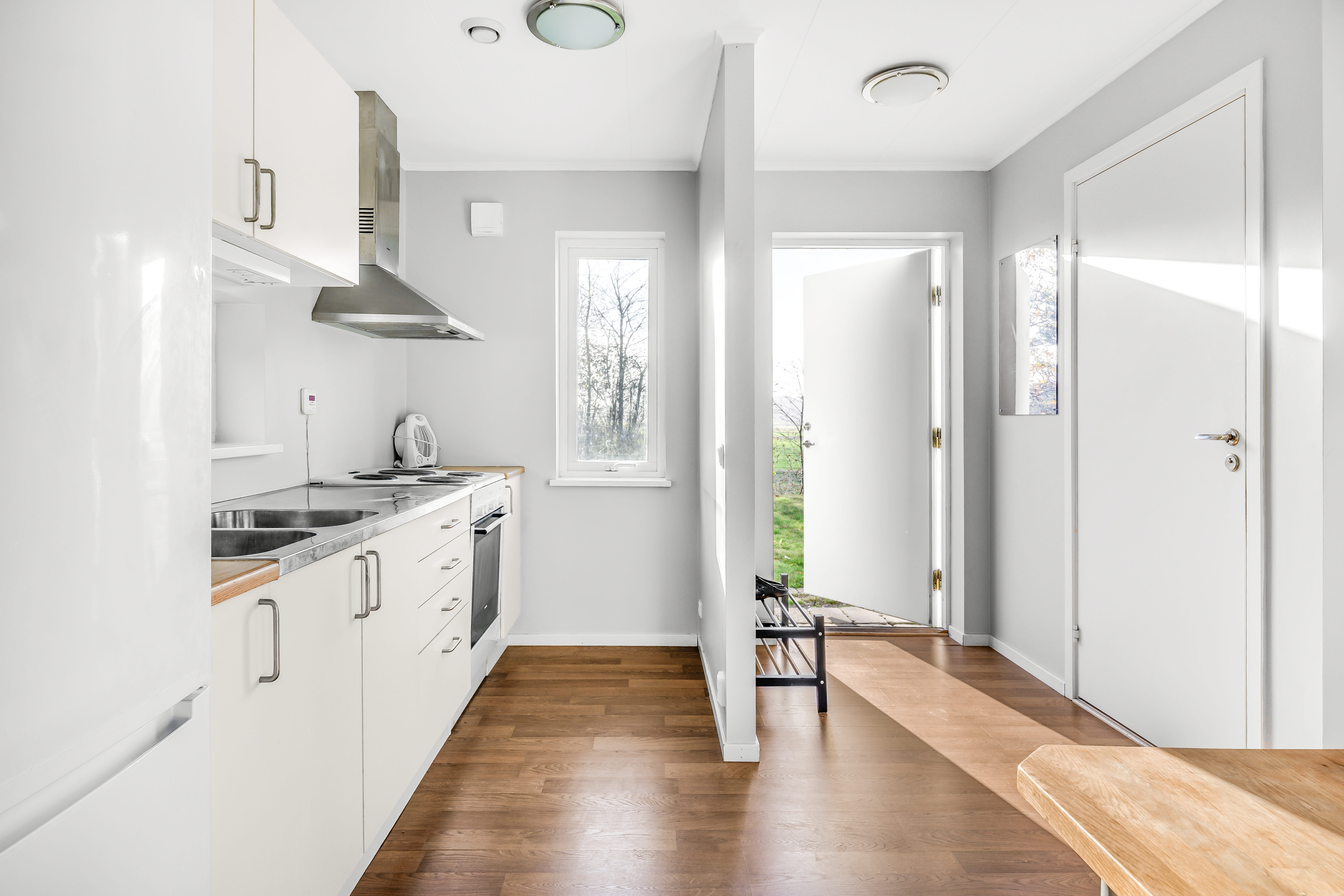 A kitchen with a wood floor