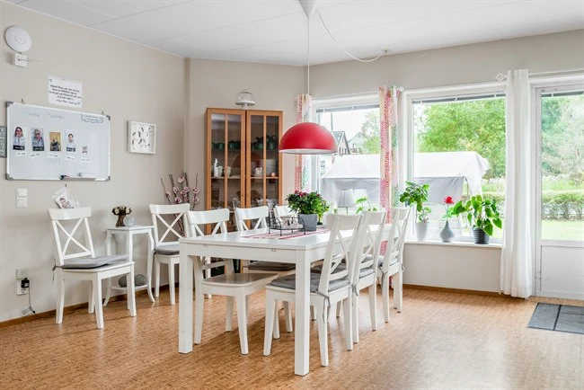 A room filled with furniture and a large window
