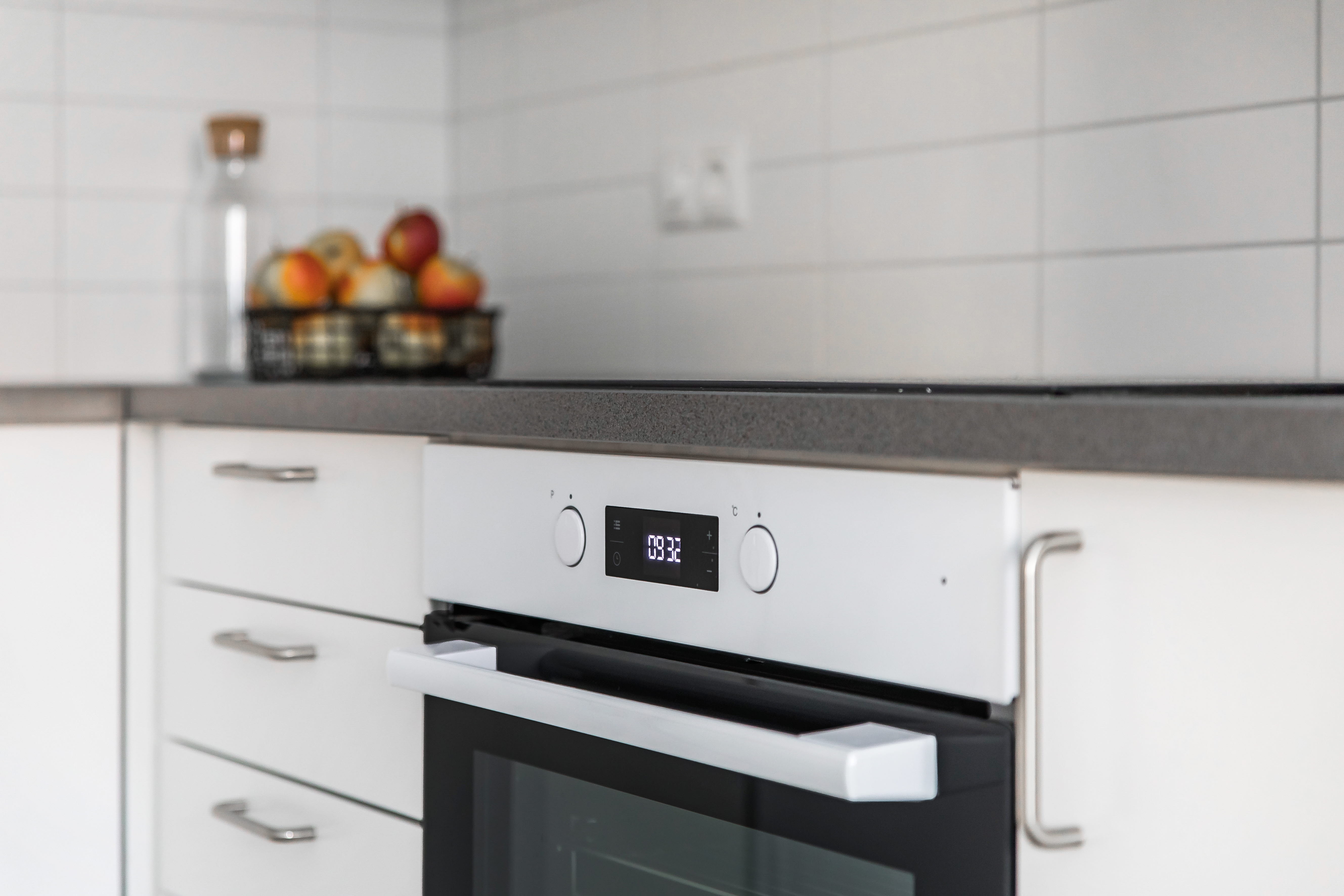 A stove top oven sitting inside of a kitchen