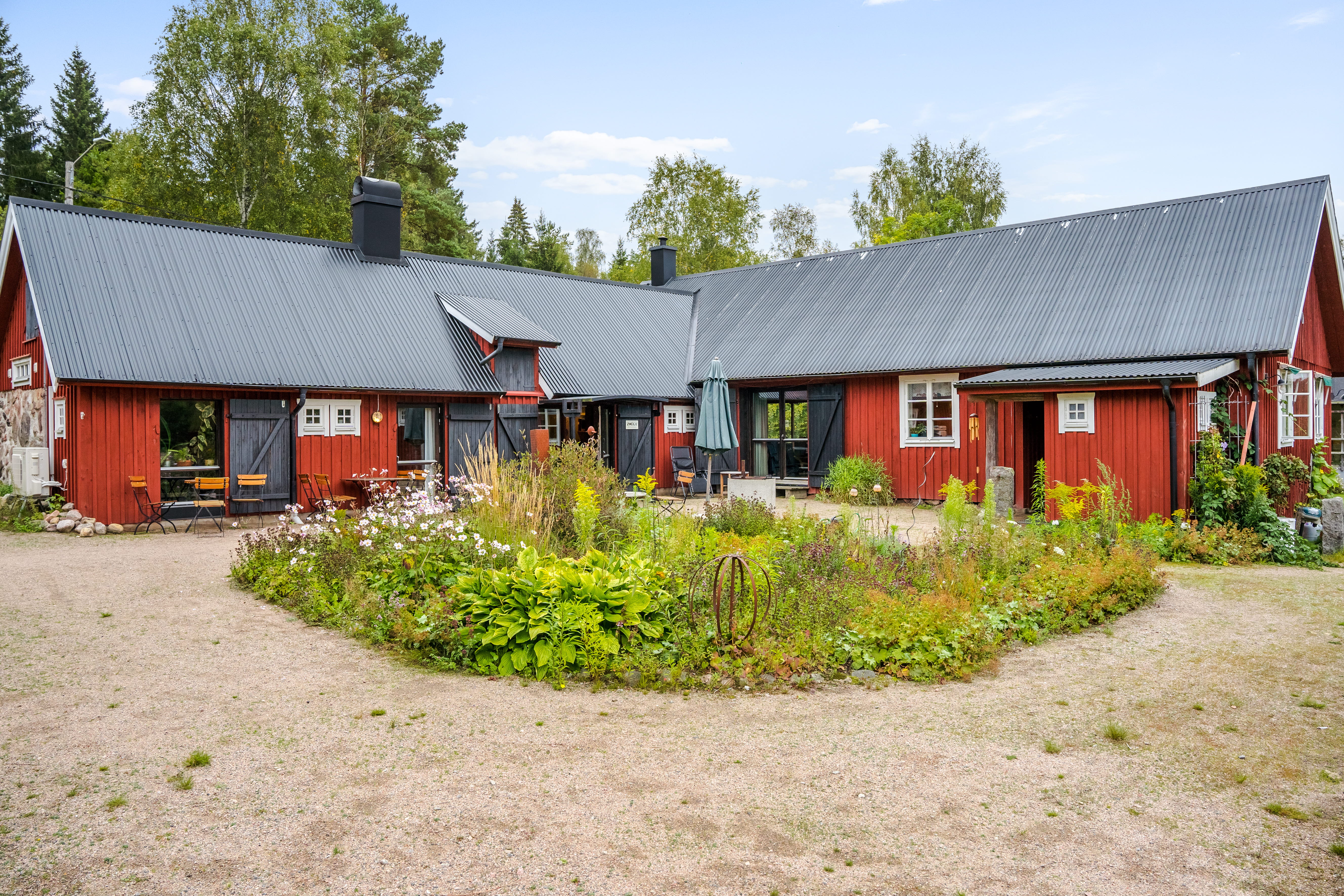 A small house in a dirt field