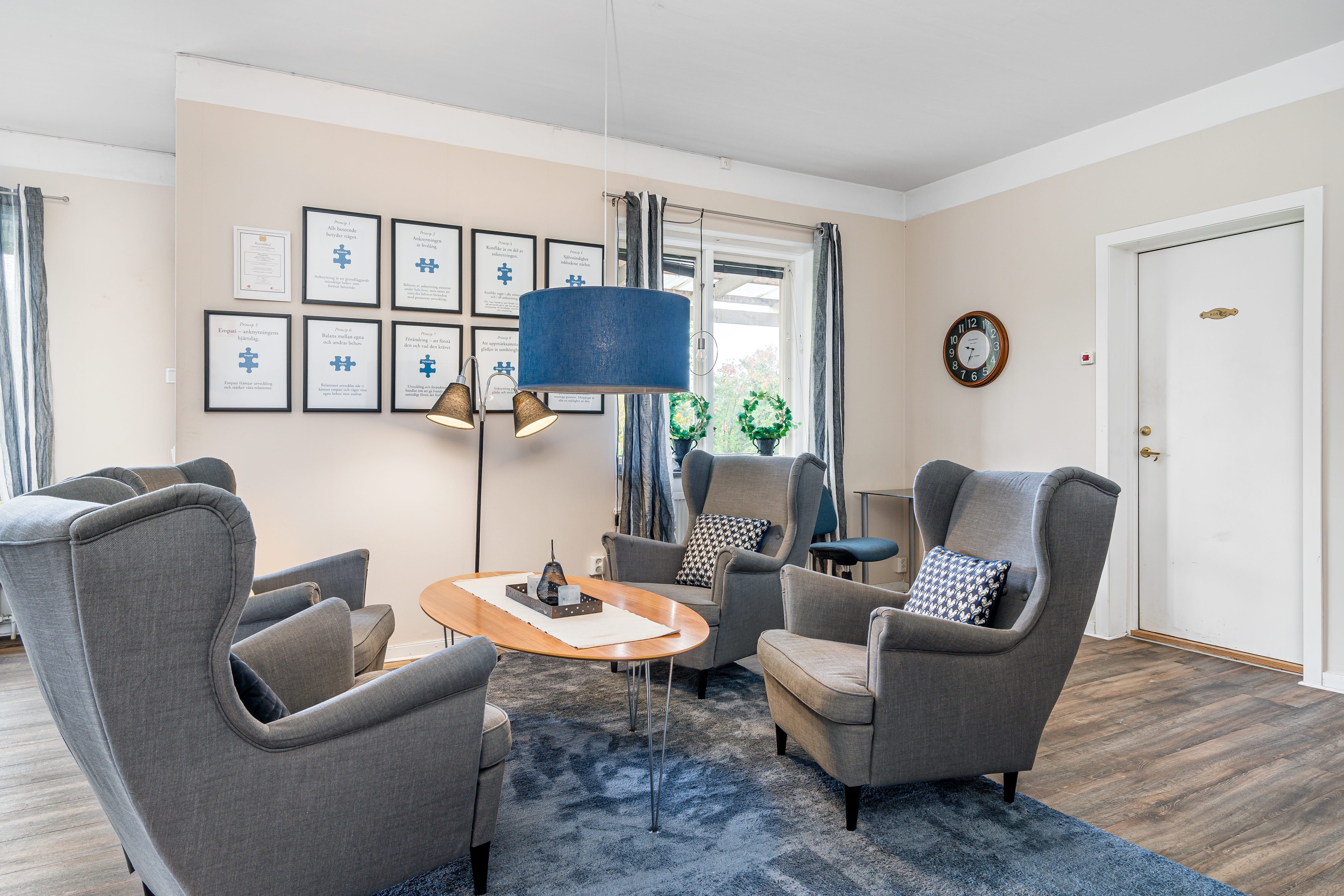 A living room filled with furniture and a fireplace