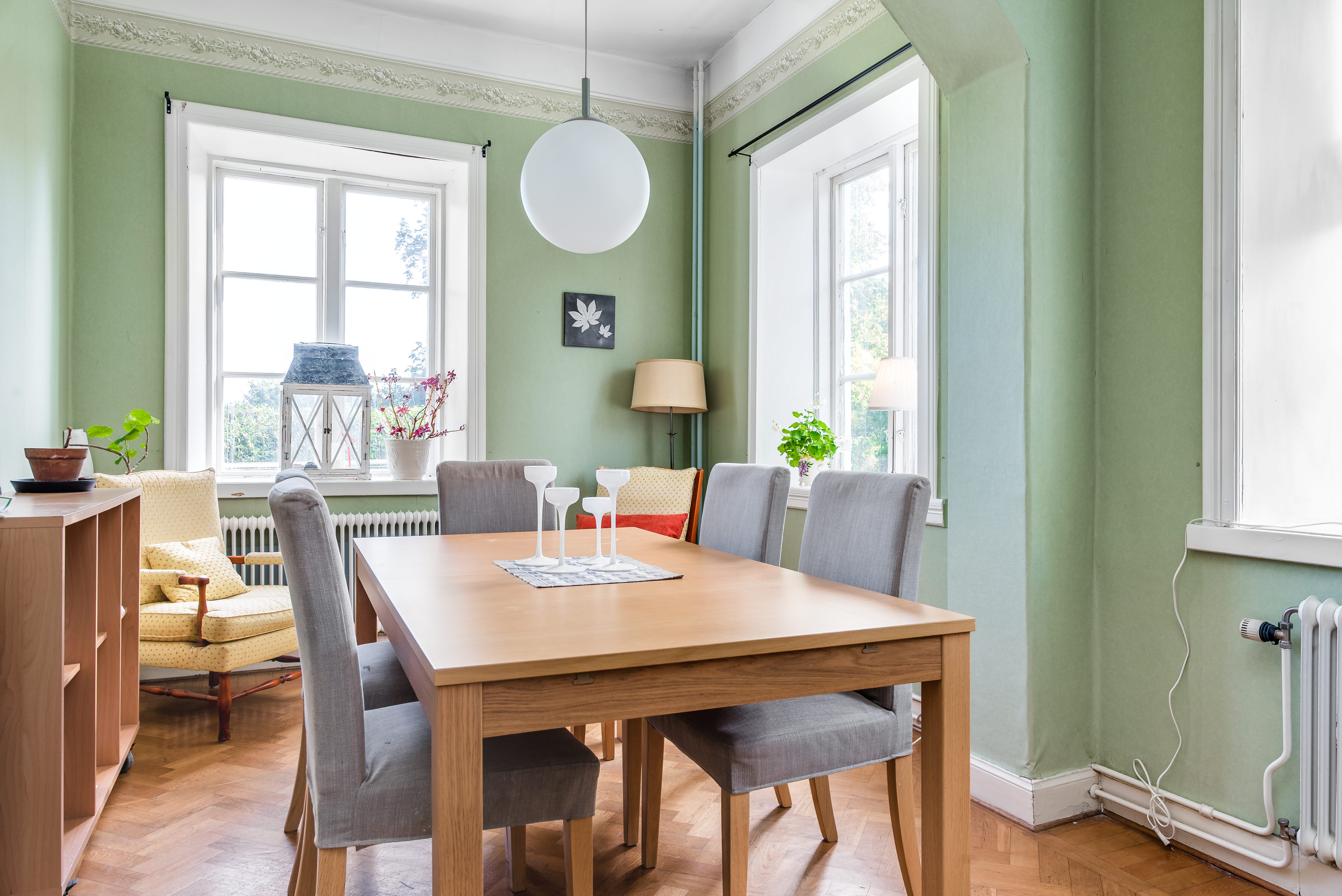 A dining room table in front of a window