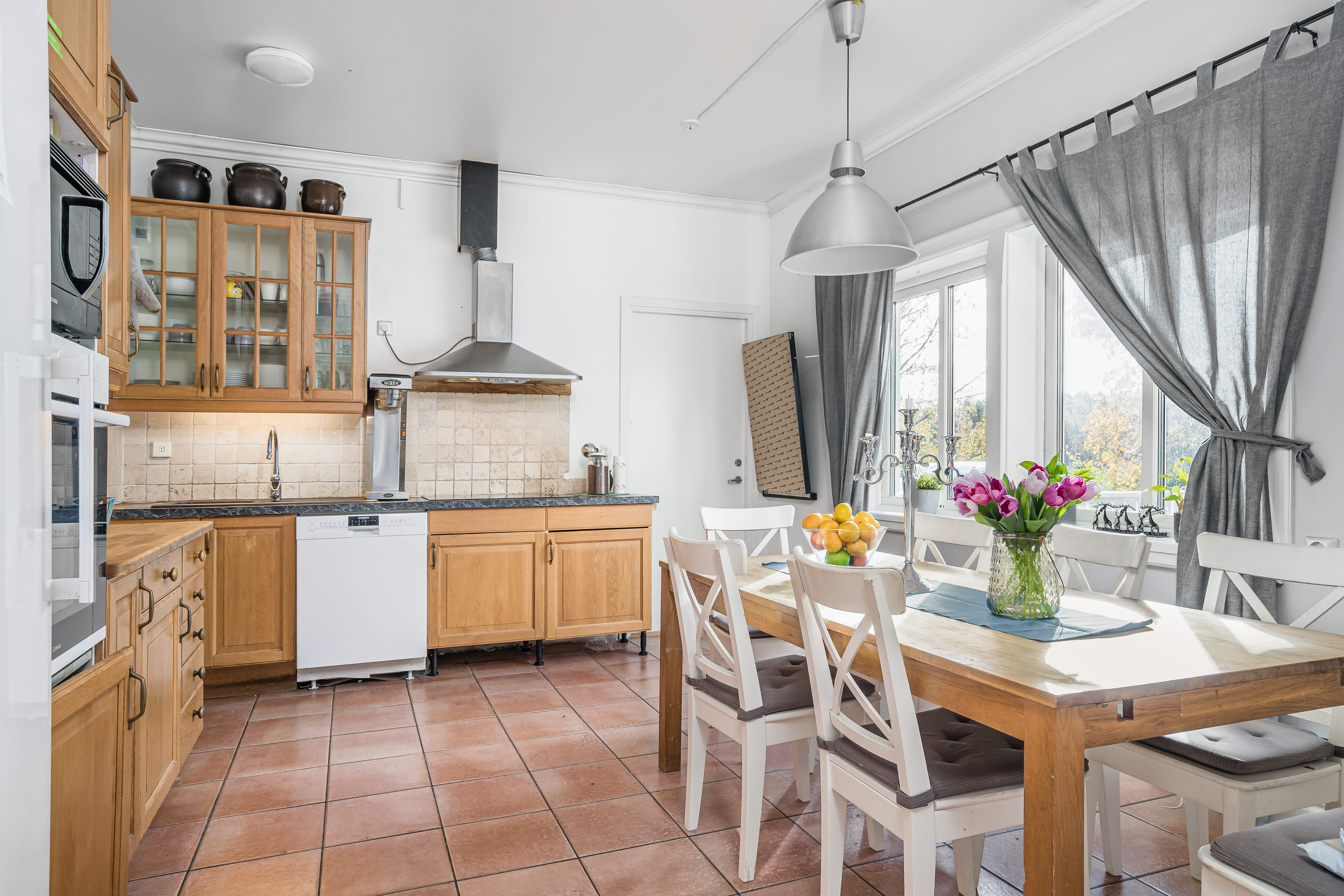 A kitchen with a dining table