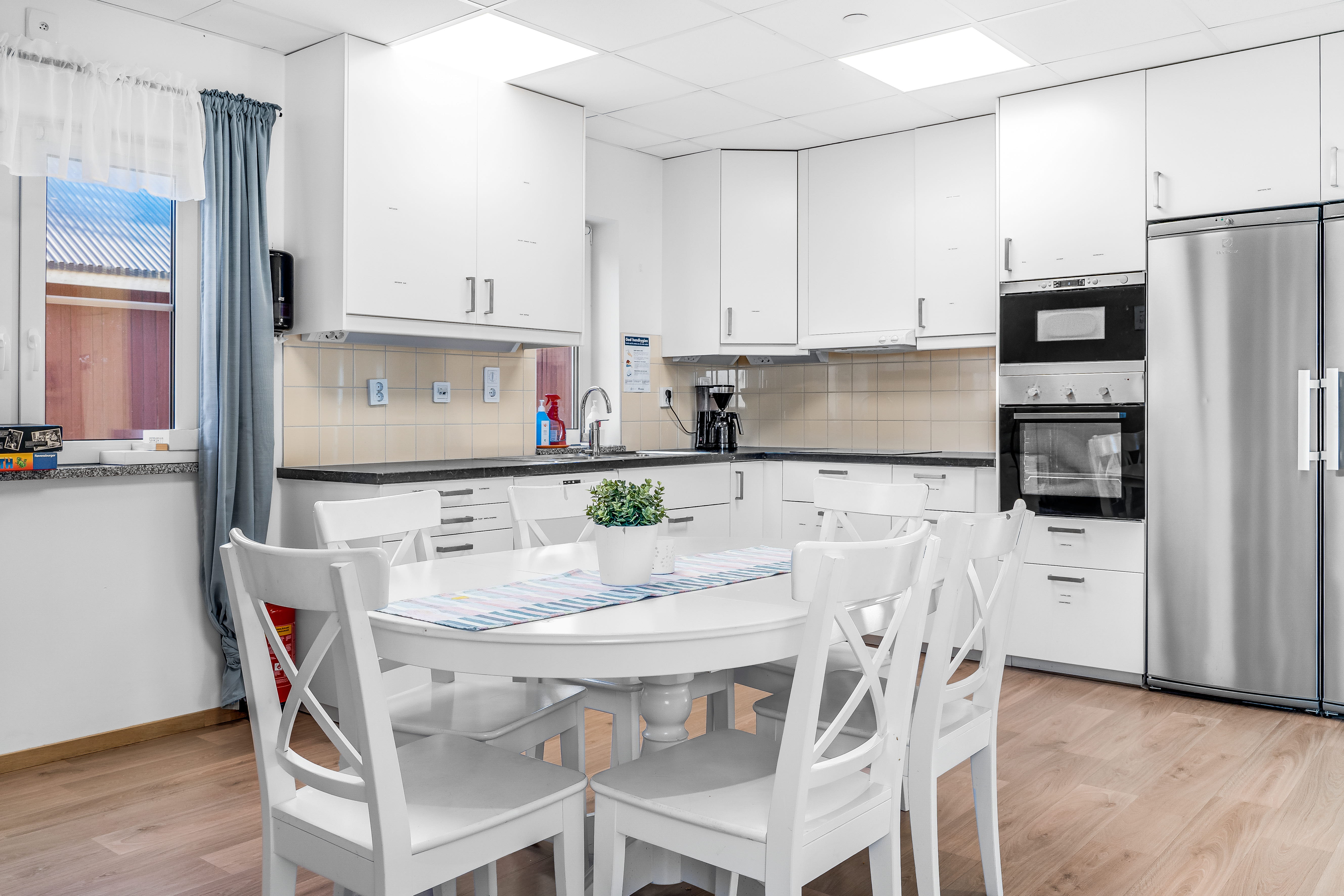 A kitchen with a wood floor