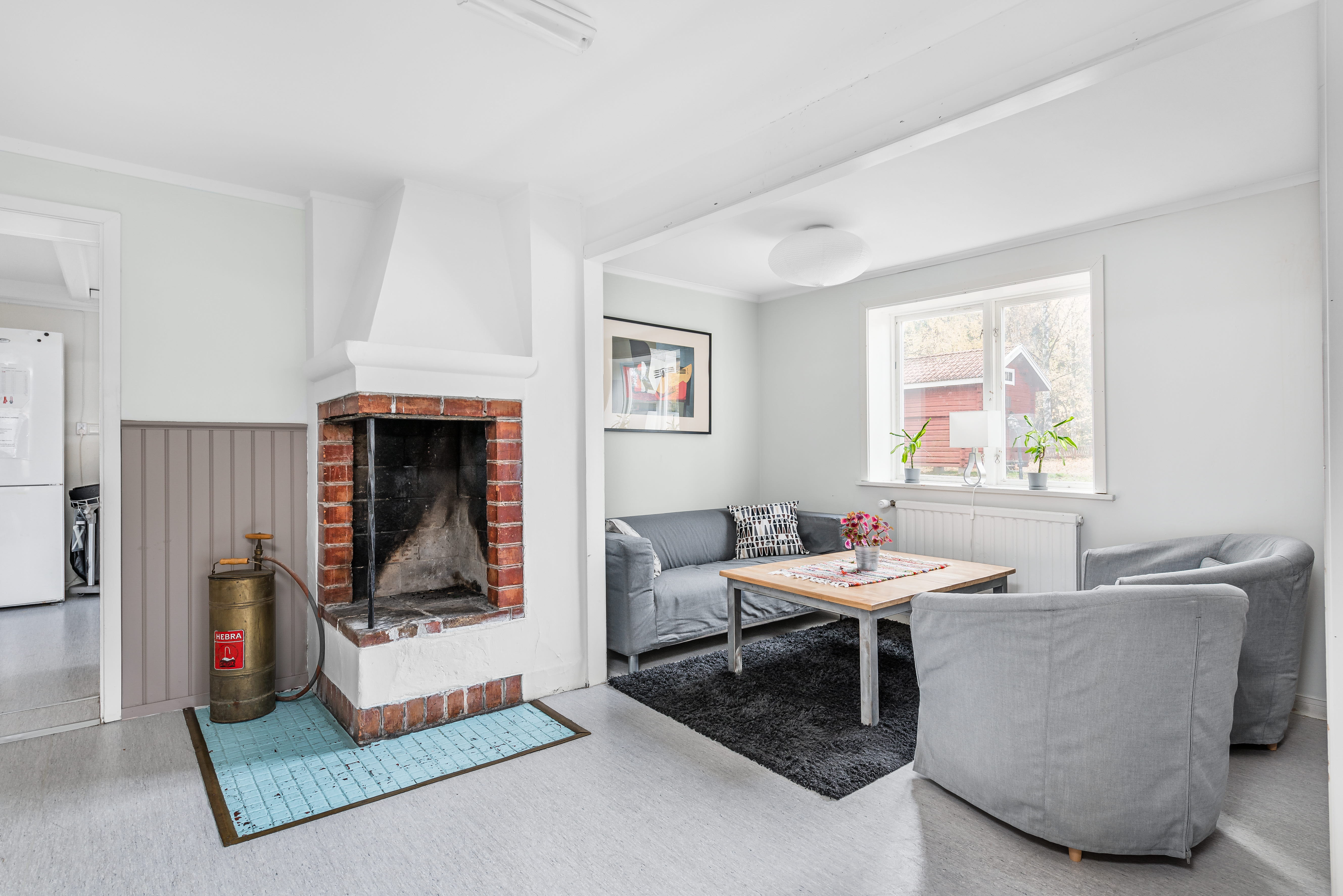 A living room filled with furniture and a fire place