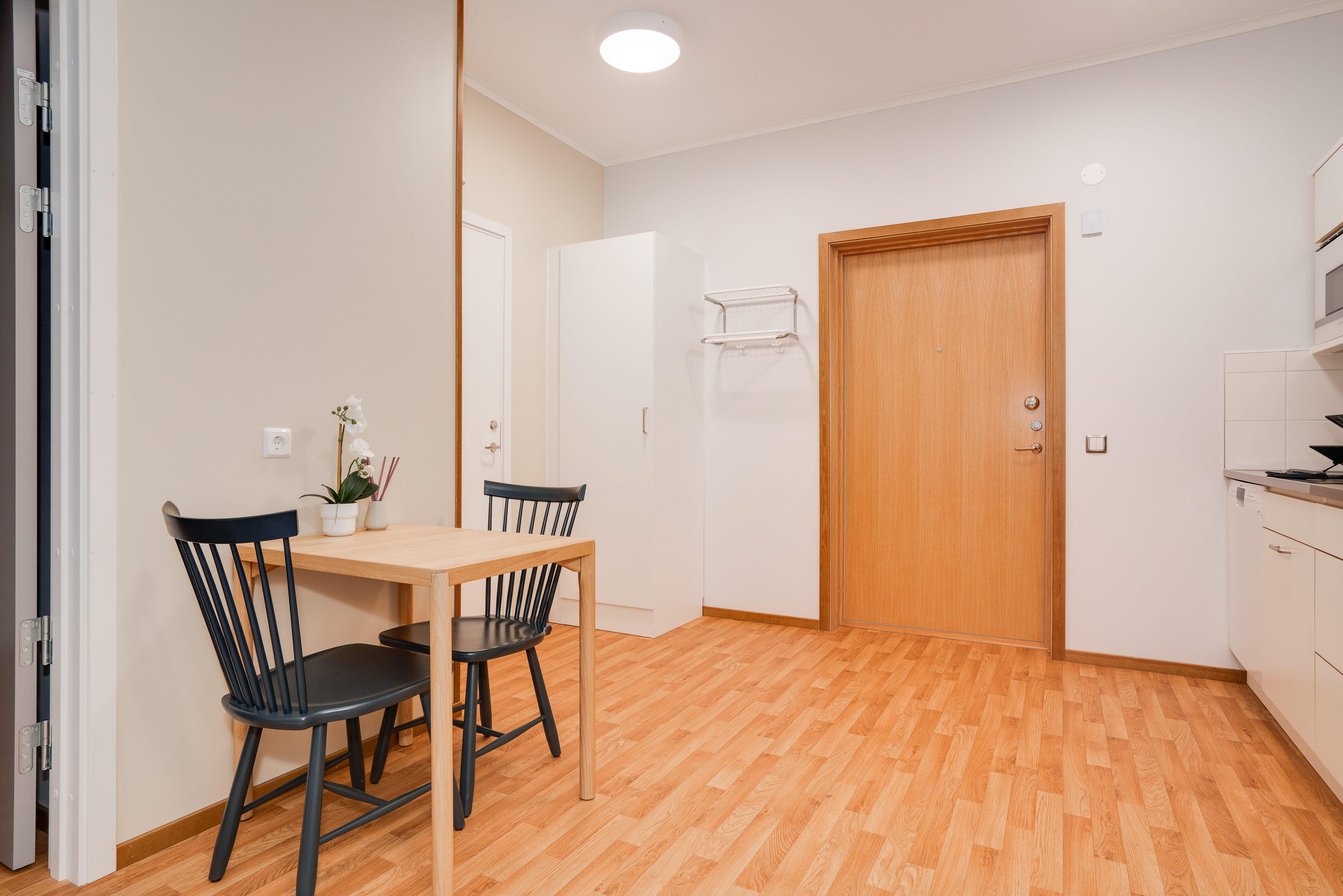 A kitchen with a wood floor