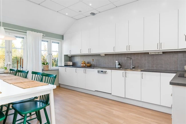 A kitchen with a wood floor