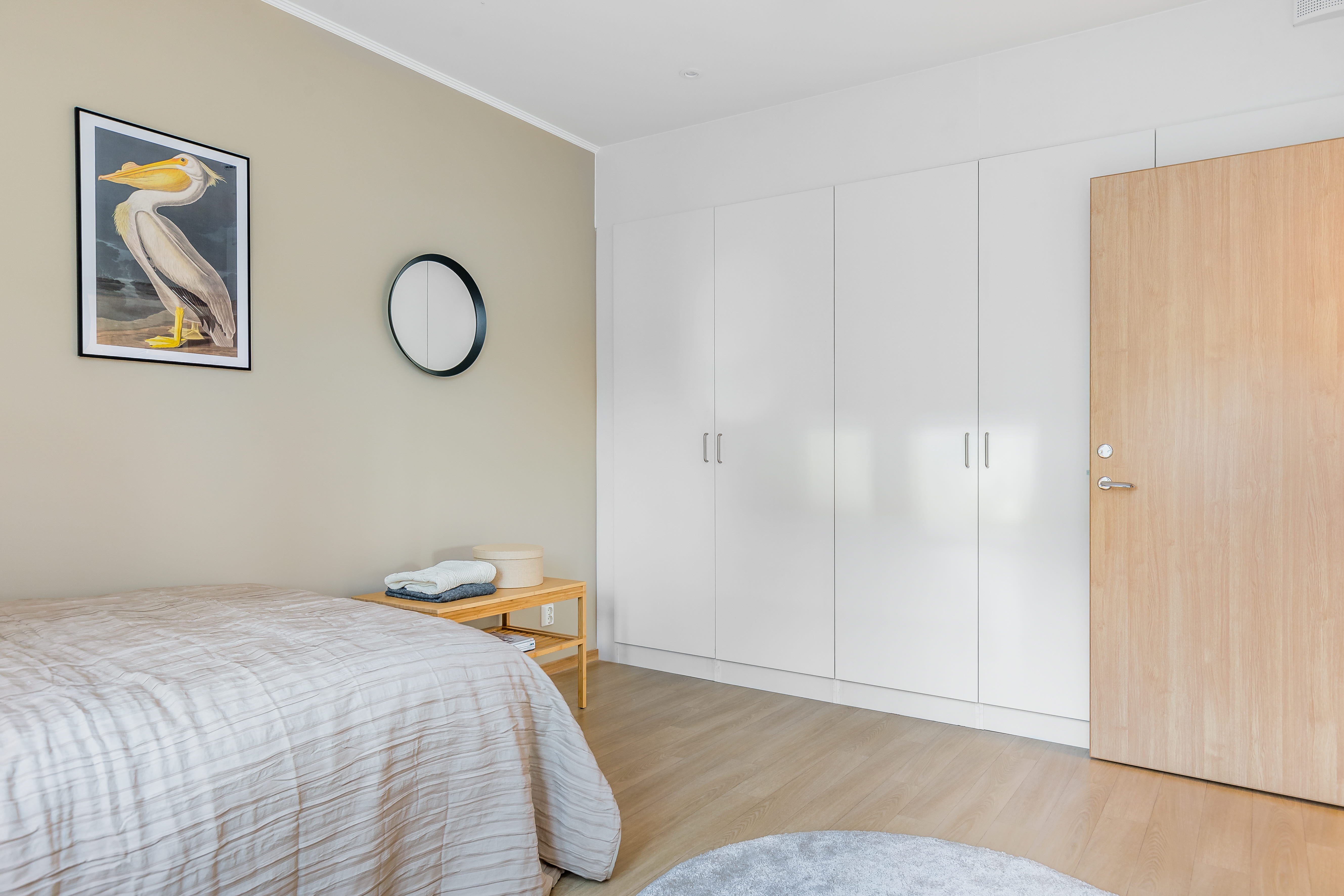 A bedroom with a bed in a room