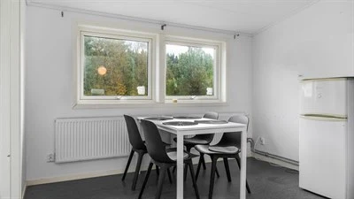 A room filled with furniture and a large window