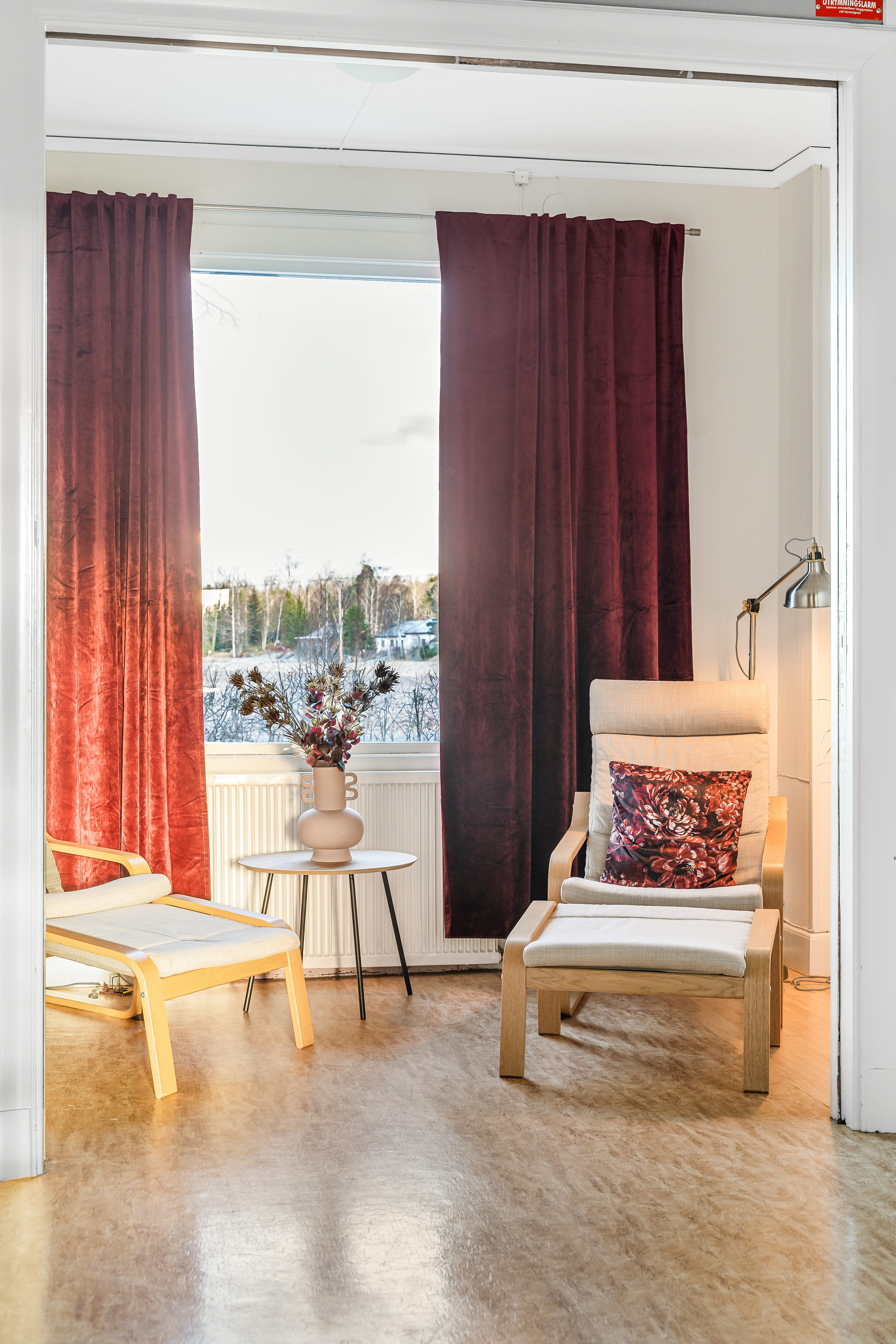 A living room filled with furniture and a large window