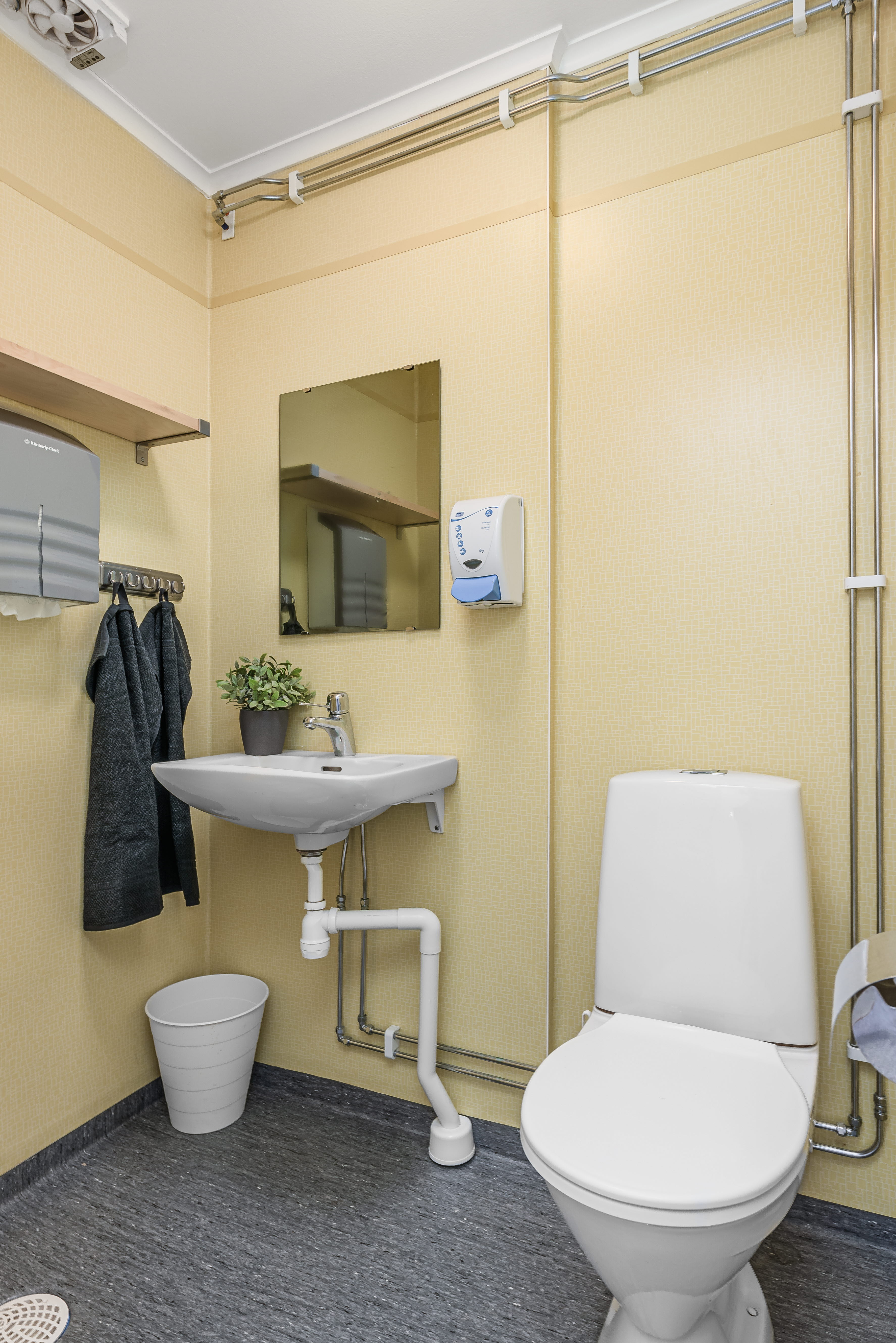 A room with a sink and a mirror