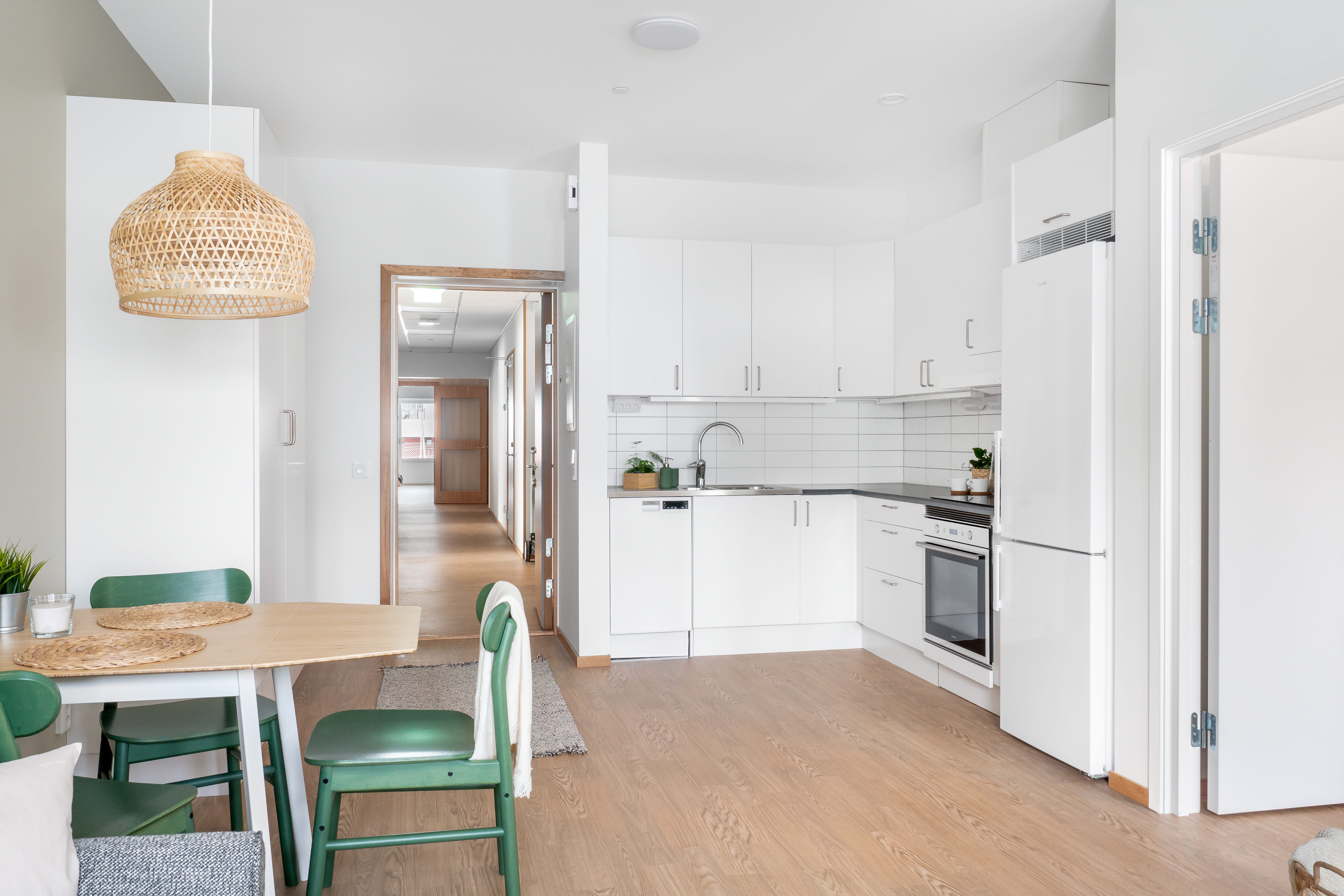 A kitchen with a wood floor