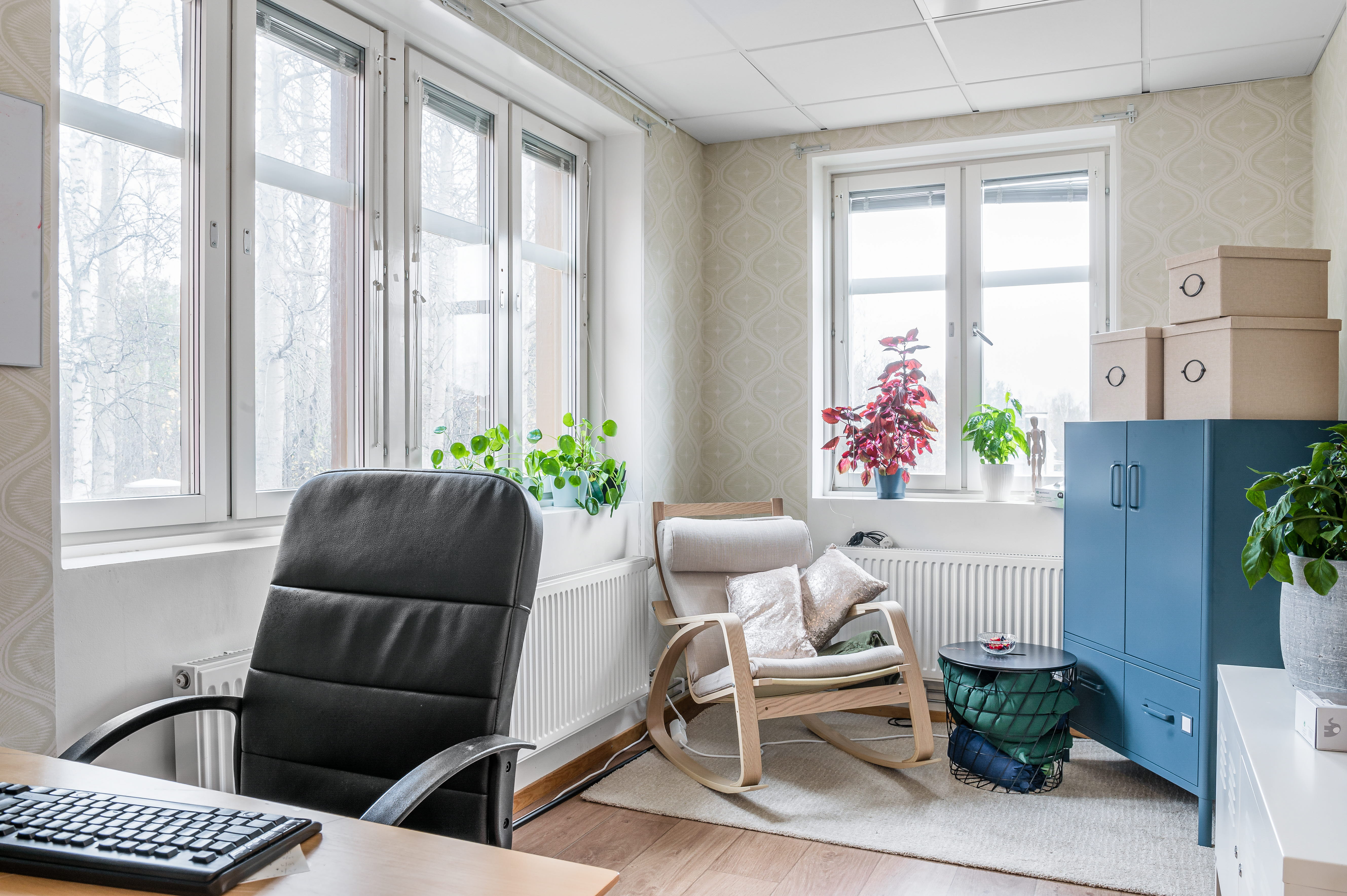 A living room filled with furniture and a large window