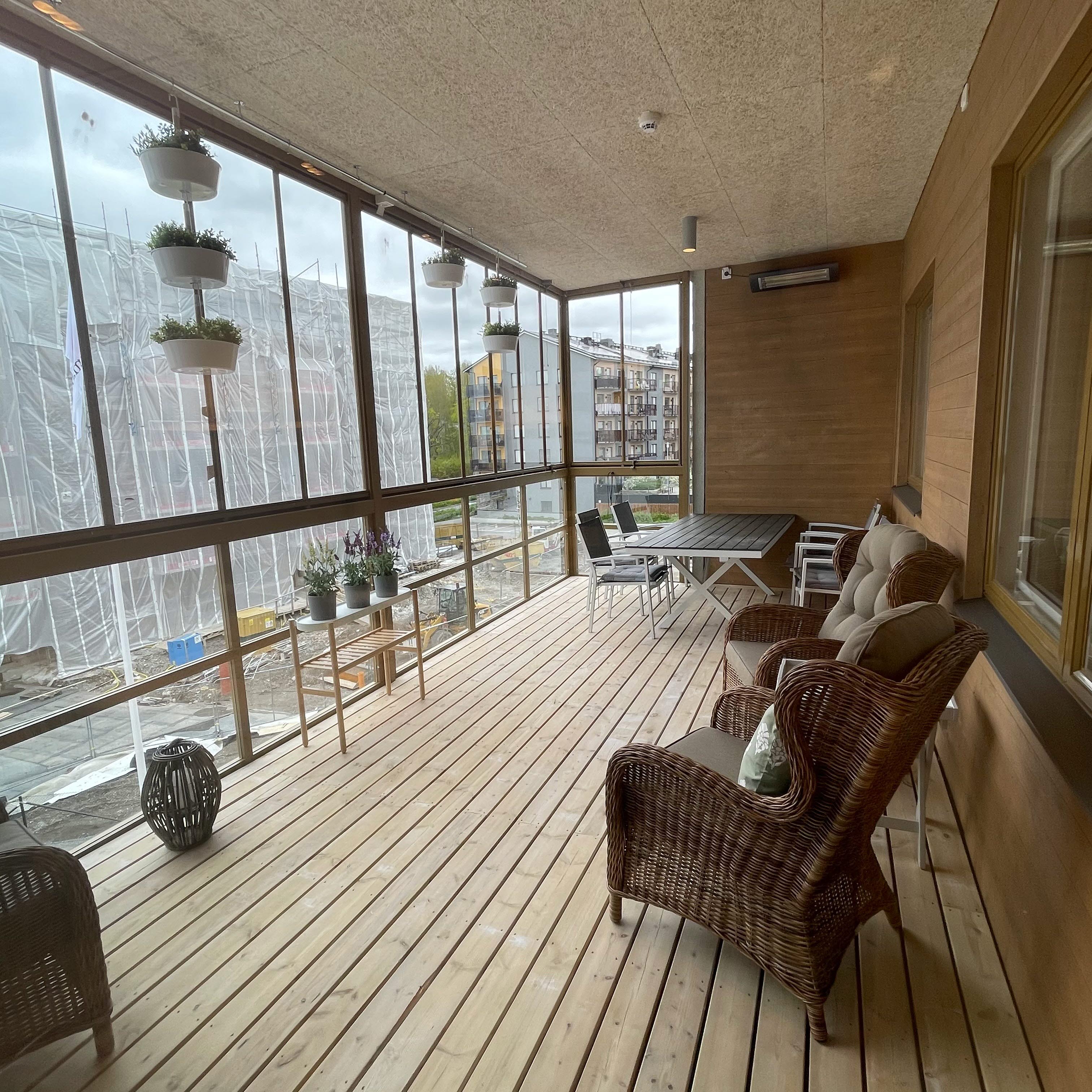 A balcony with armchairs