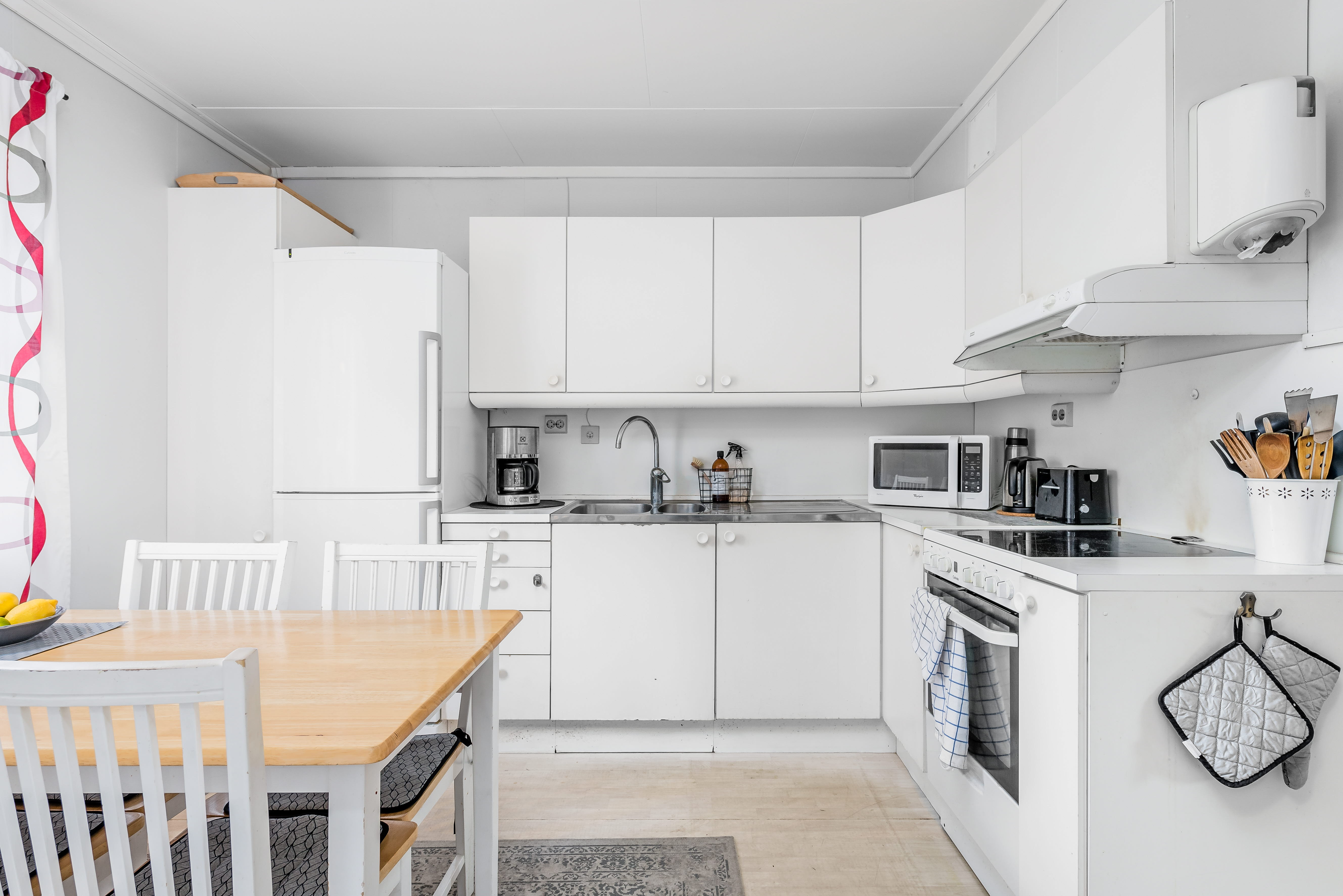 A kitchen with a dining table