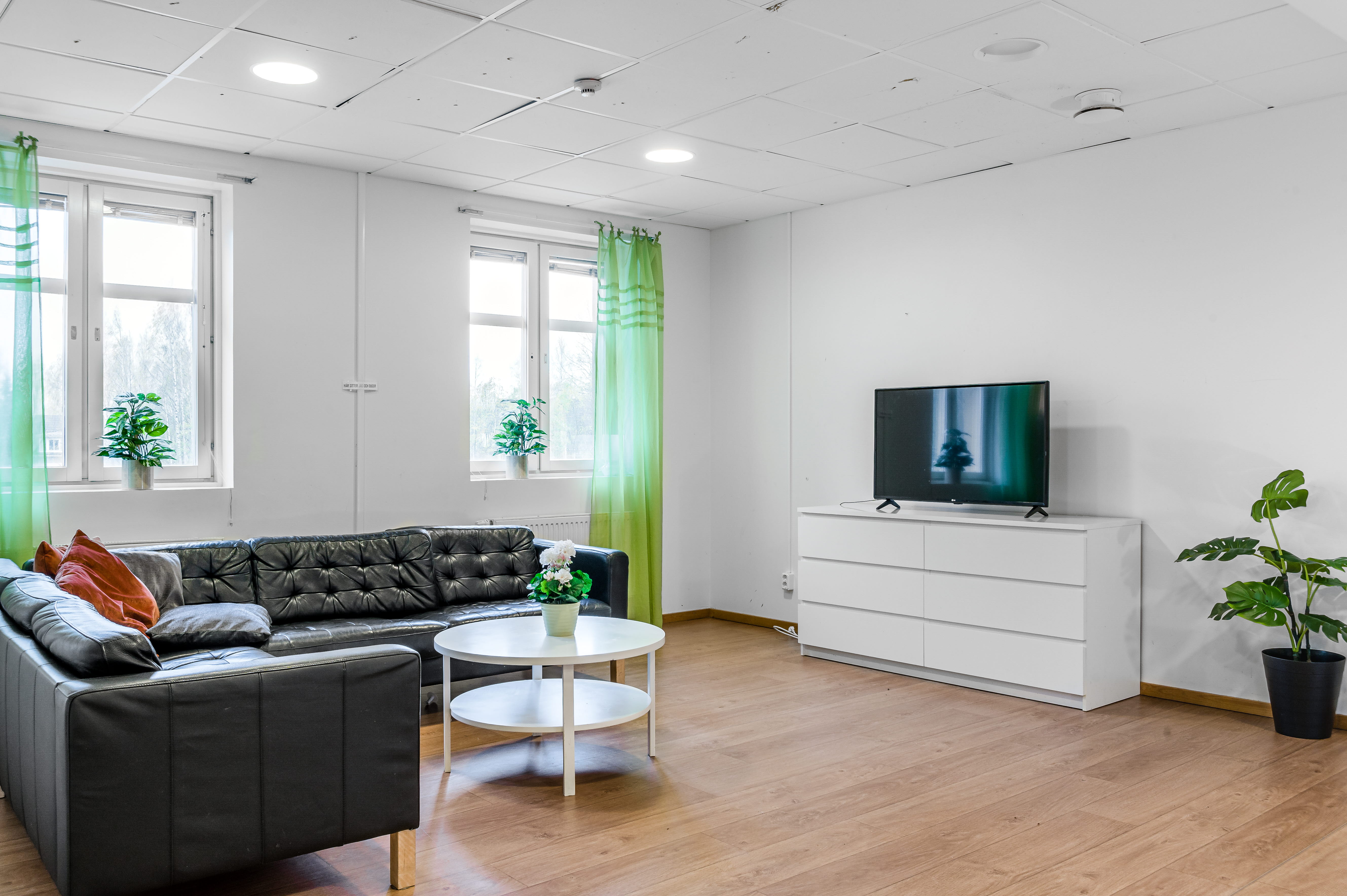 A living room filled with furniture and a flat screen tv