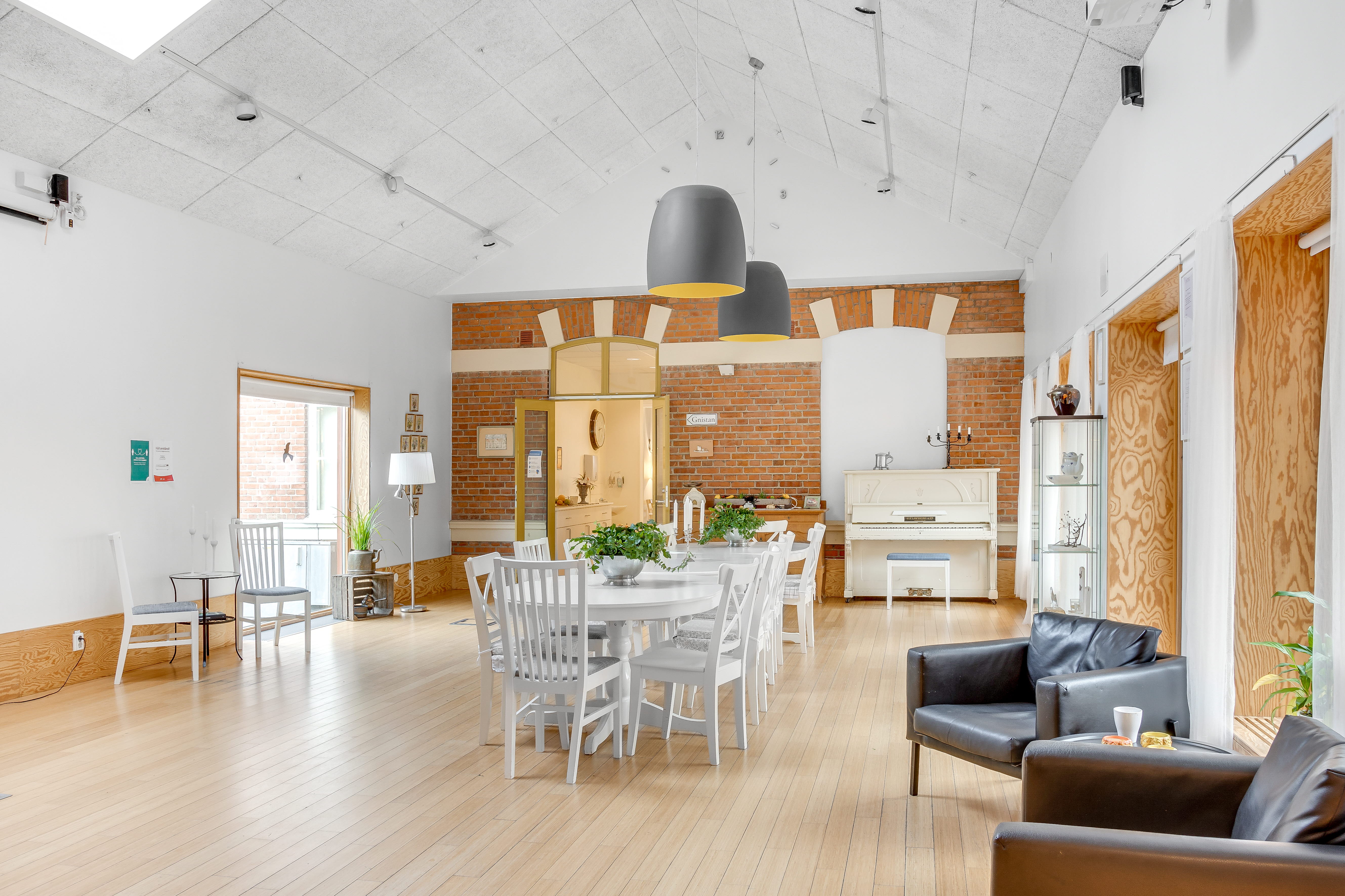 A living room filled with furniture on top of a hard wood floor