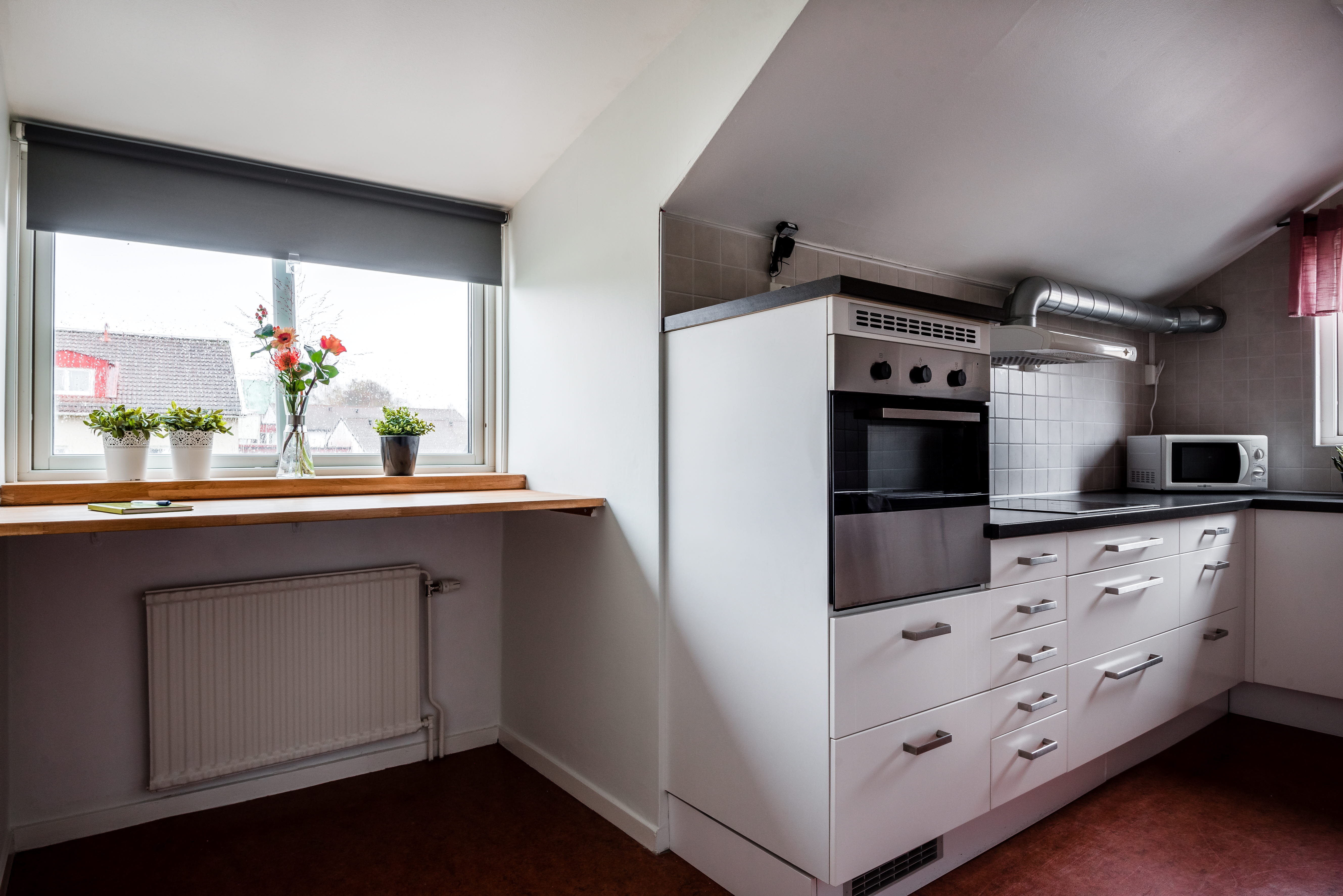 A kitchen with a wood floor
