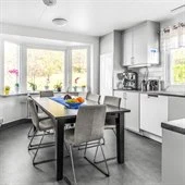 A kitchen with a window in a room