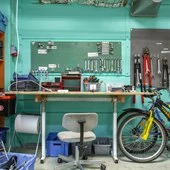 A blue bicycle in a room