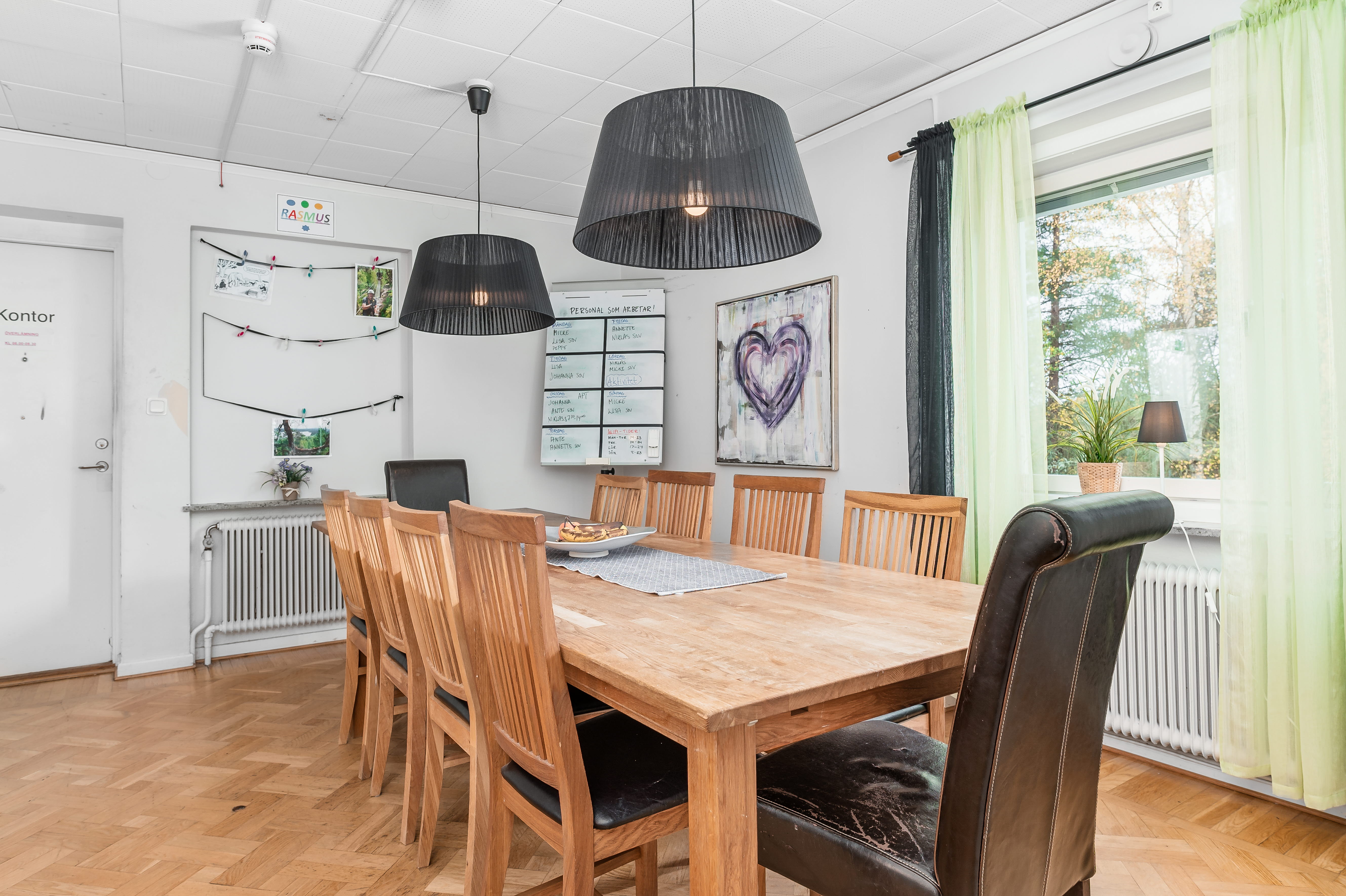 A living room with a wooden floor