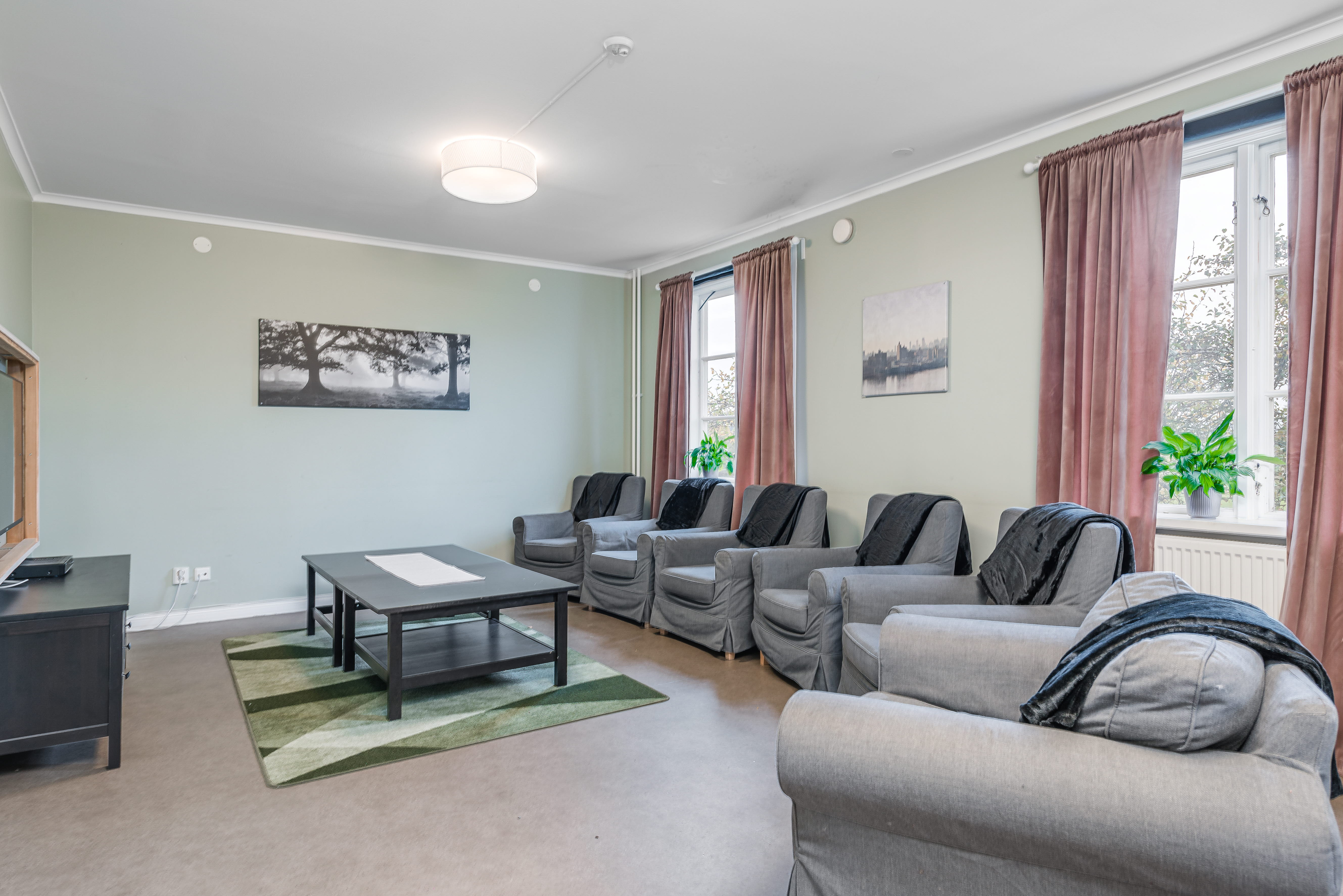 A living room filled with furniture and a large window