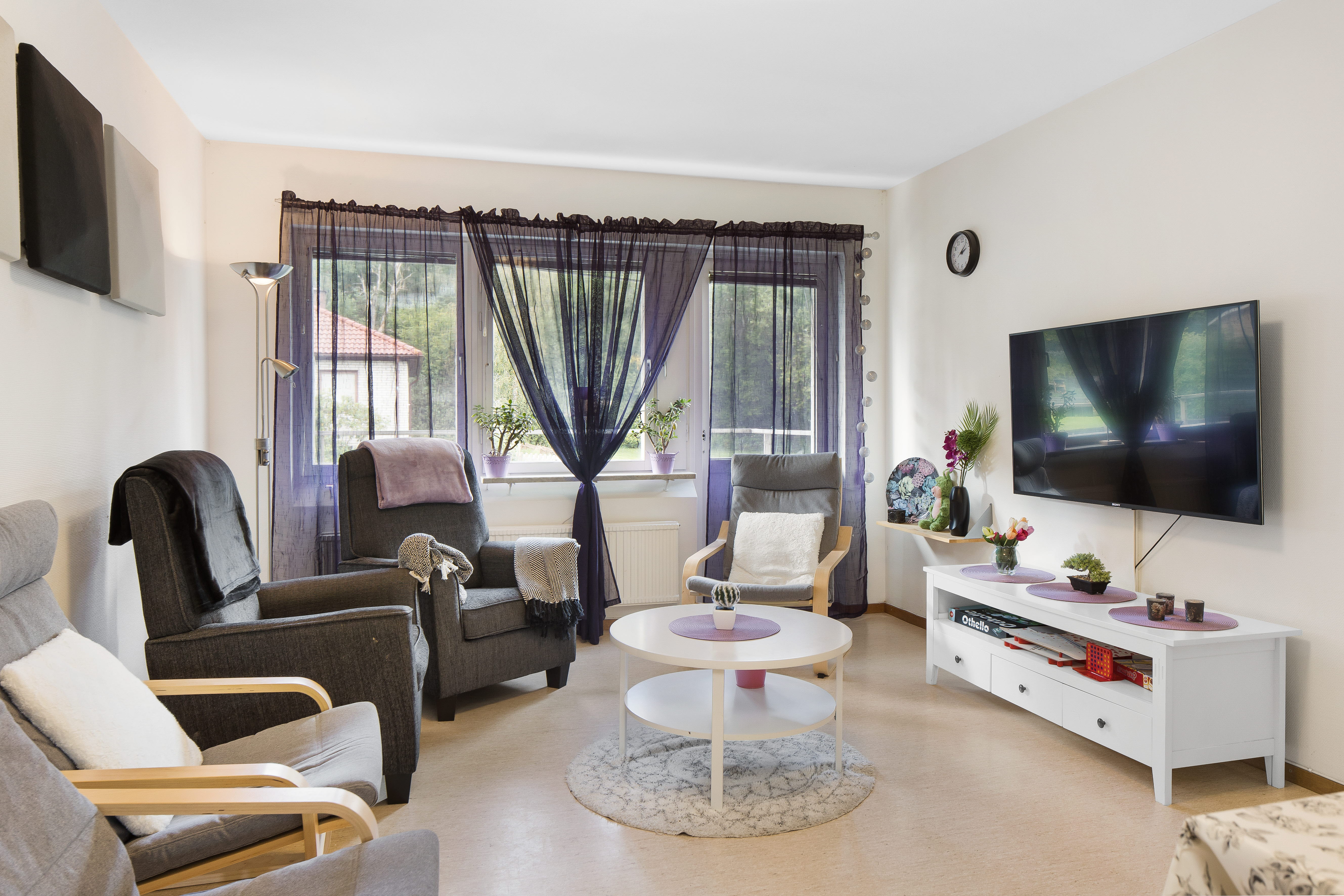 A living room filled with furniture and a fireplace