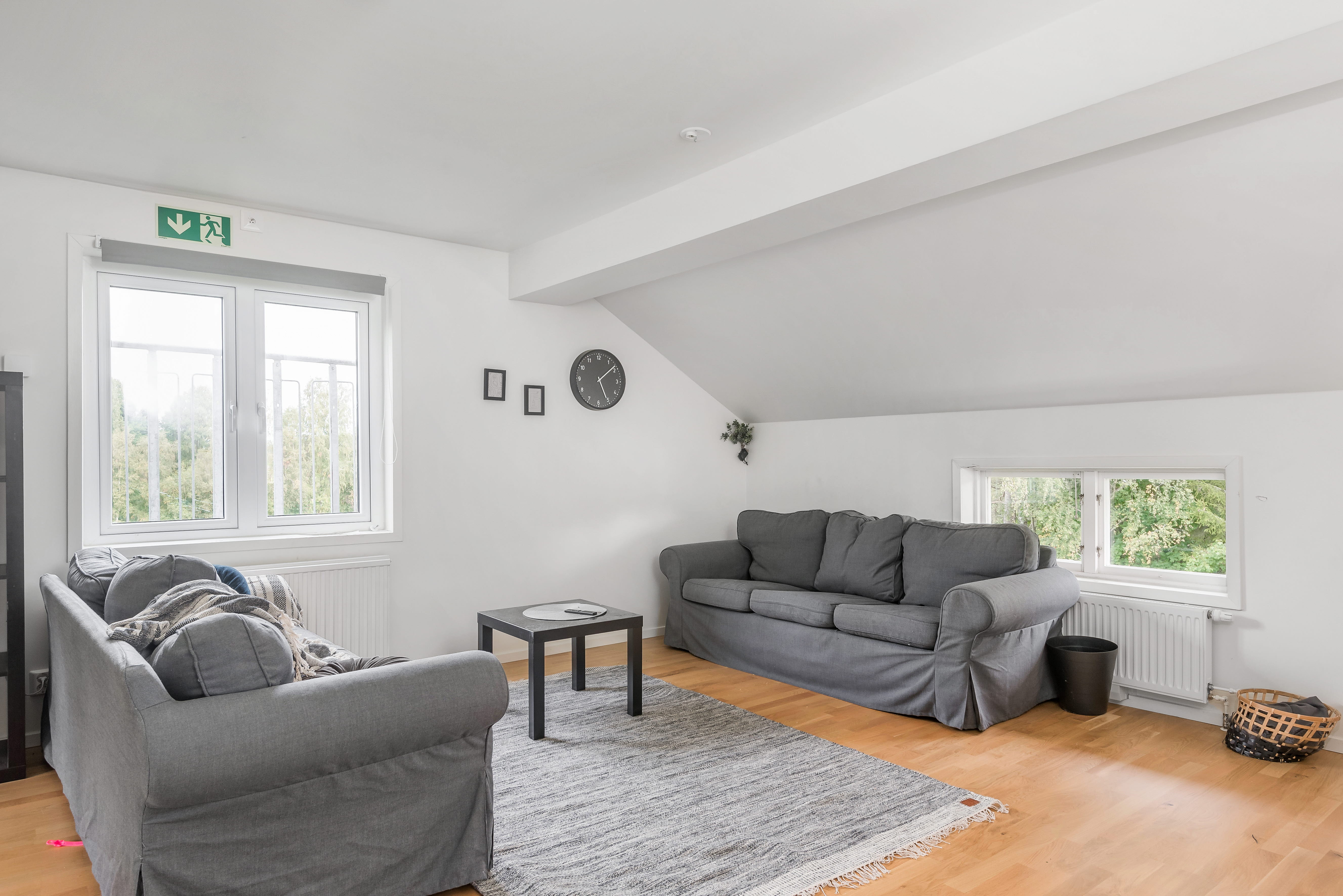 A living room filled with furniture and a large window