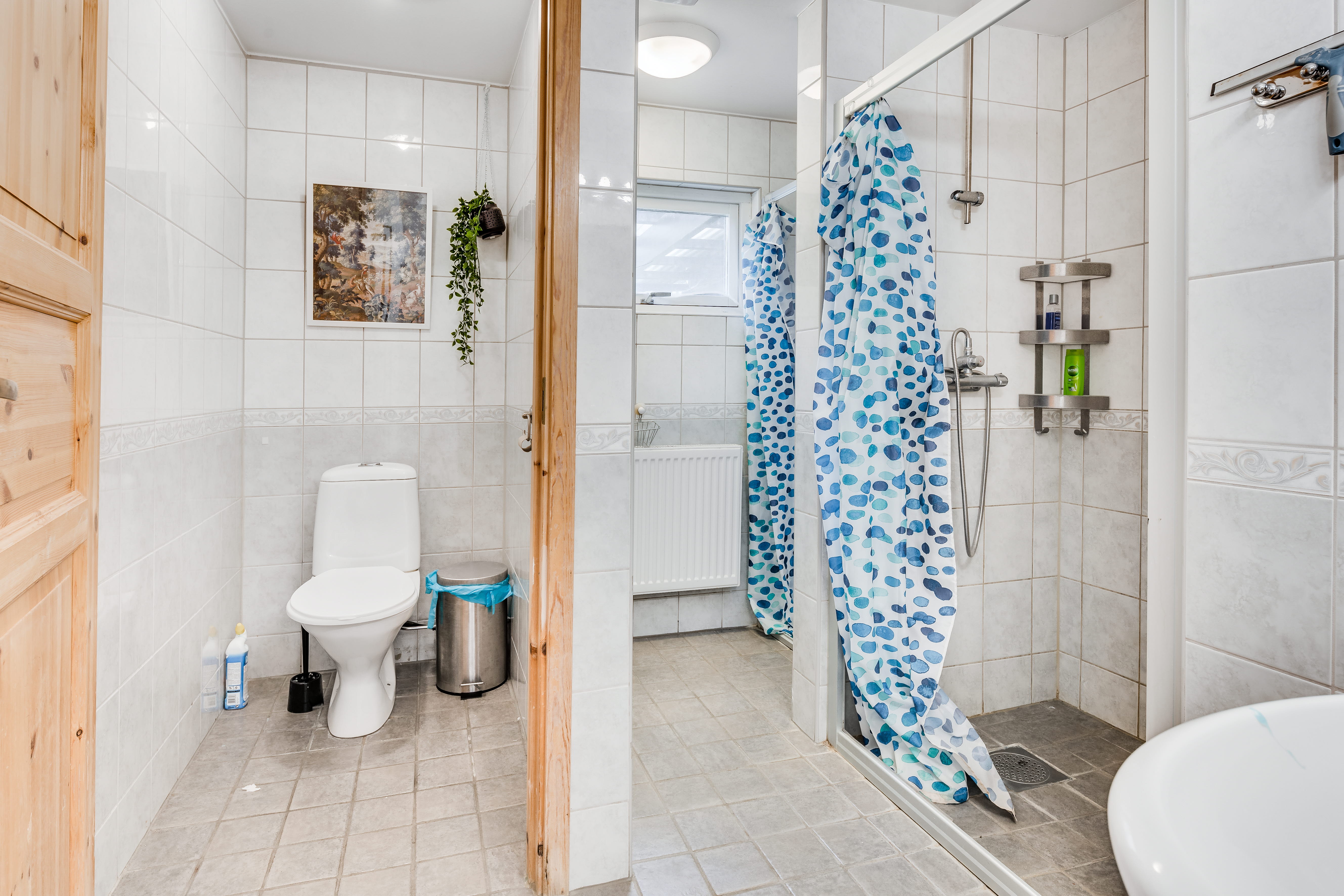 A room with a sink and a shower