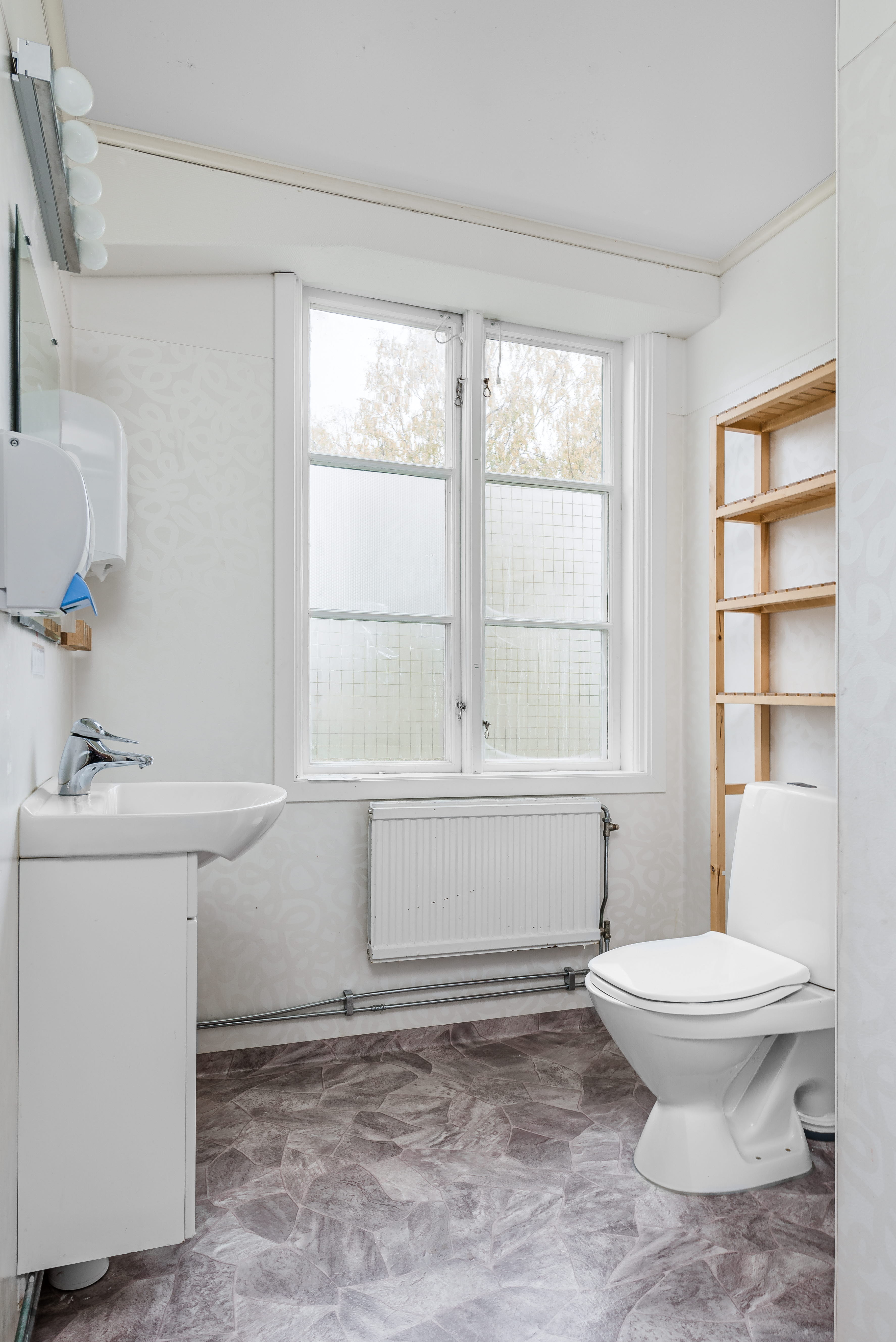 A room with a sink and a window