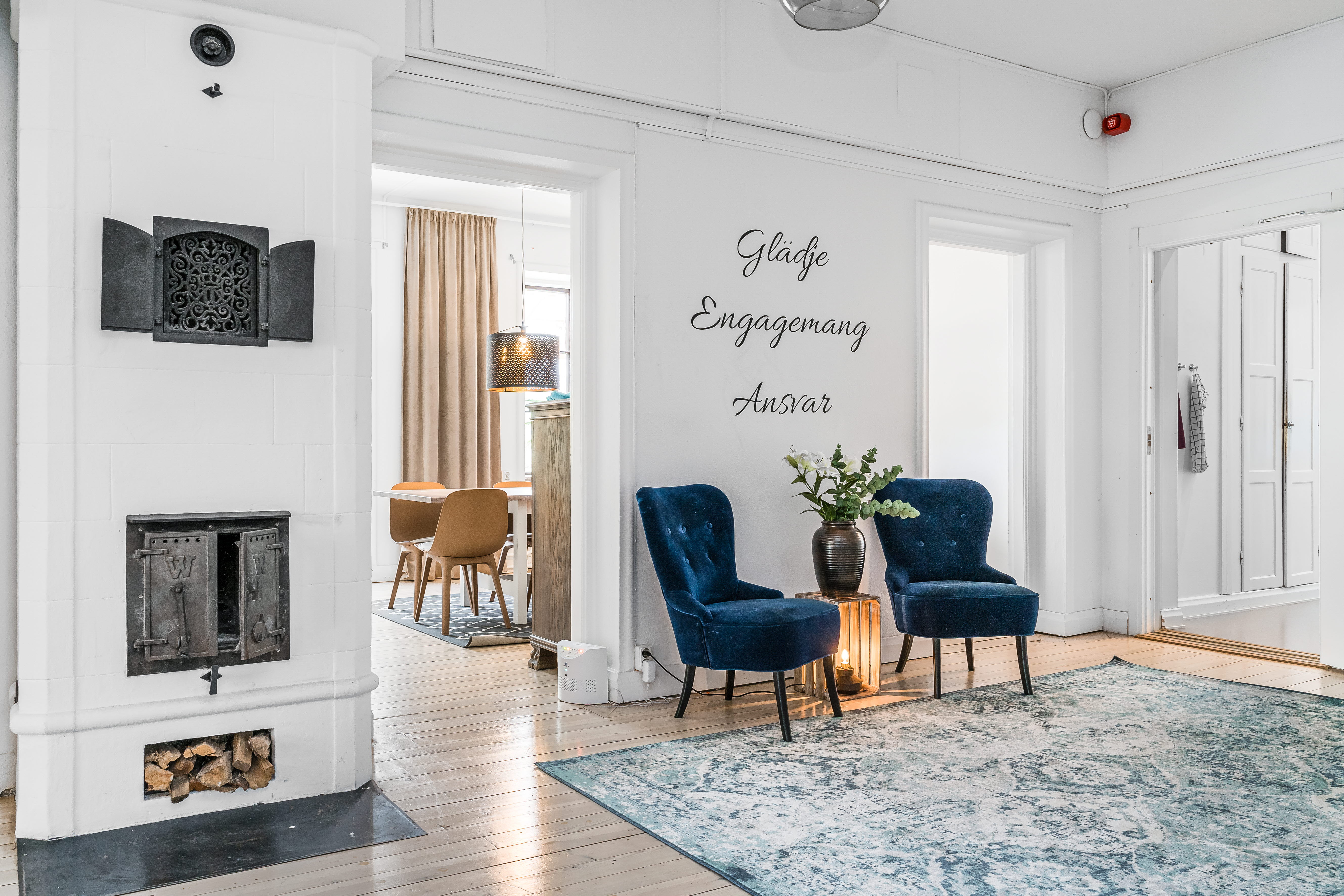 A living room filled with furniture and a fire place