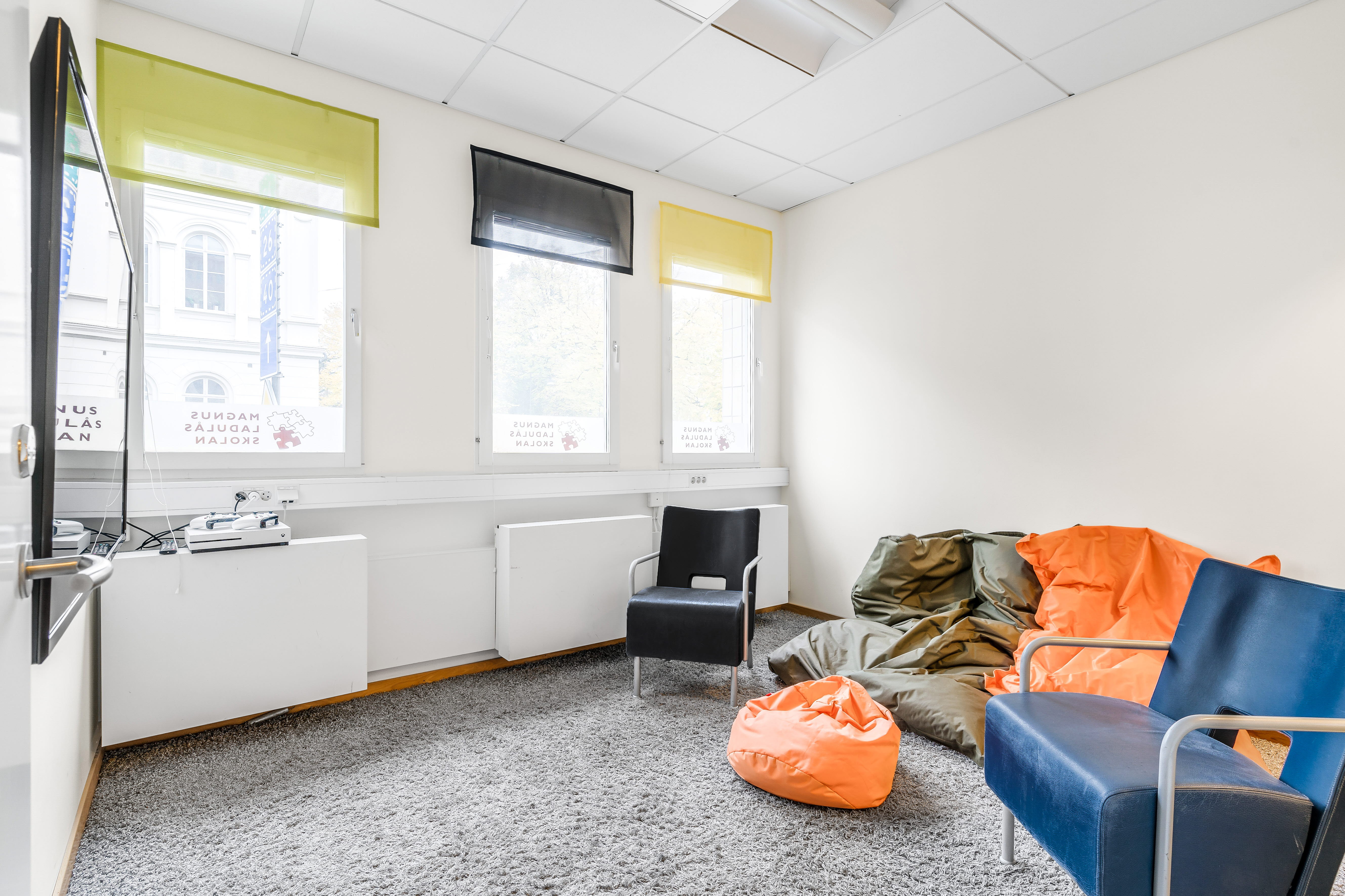 A living room filled with furniture and a large window