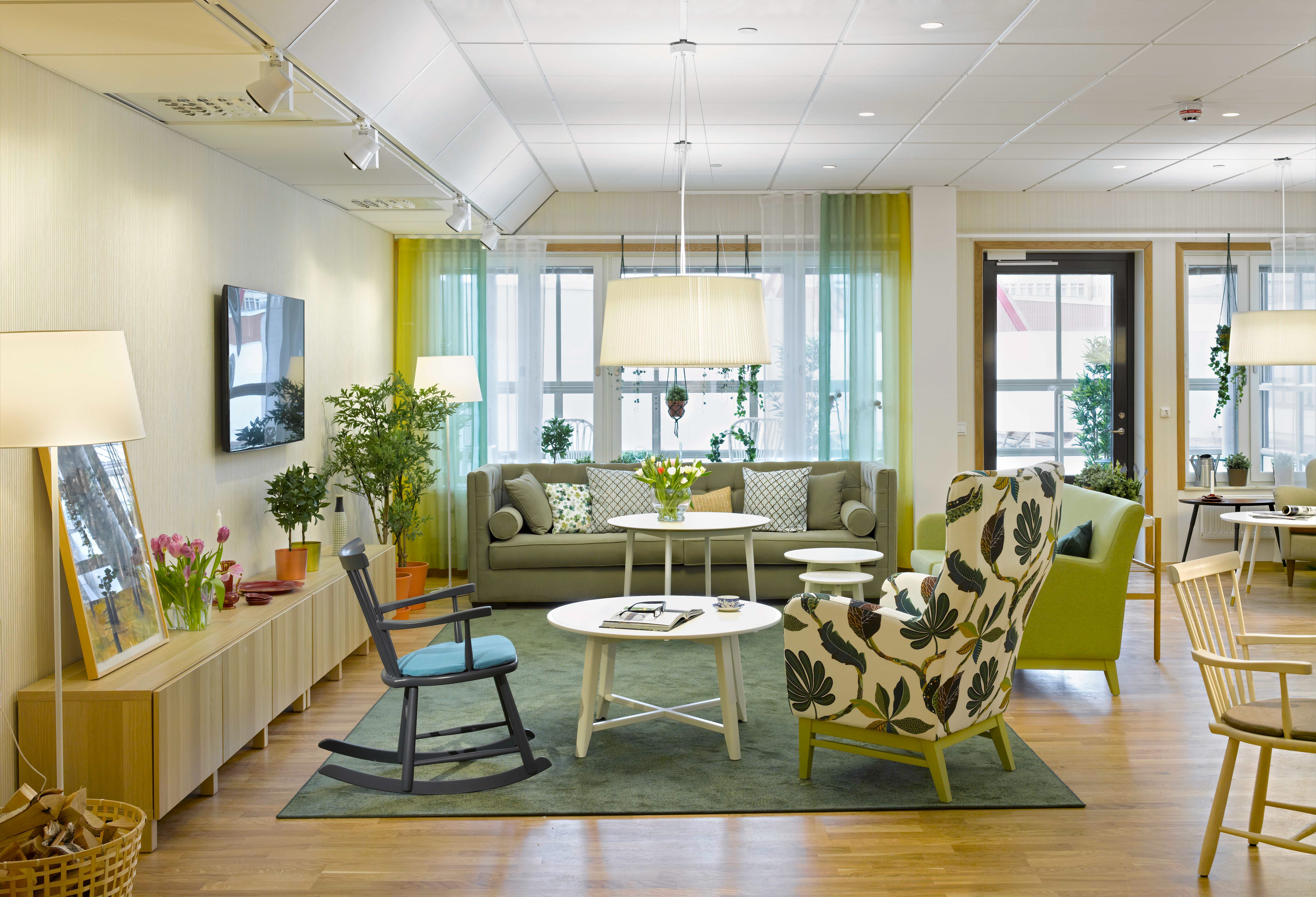 A living room filled with furniture and a large window