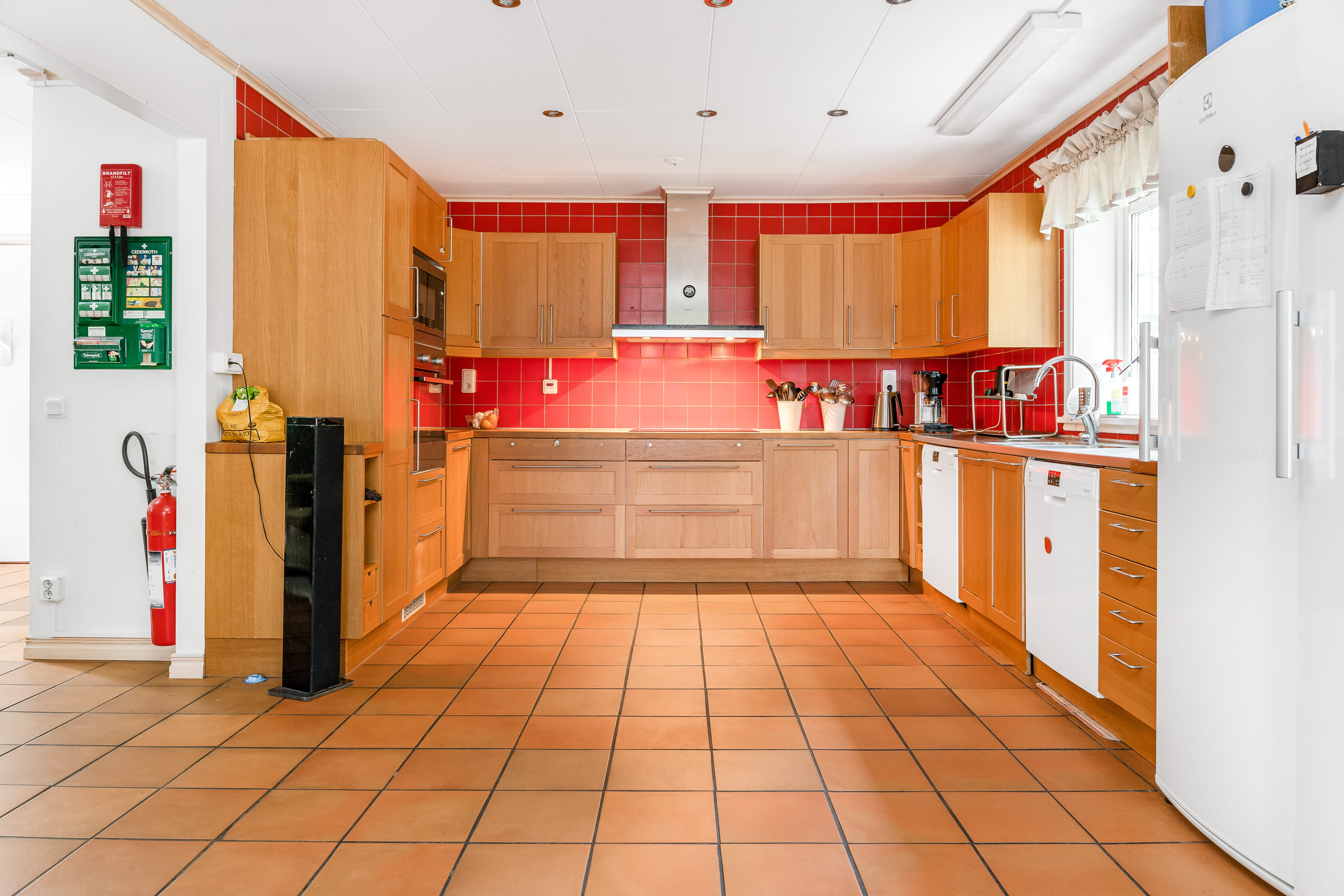 A kitchen with a tile floor