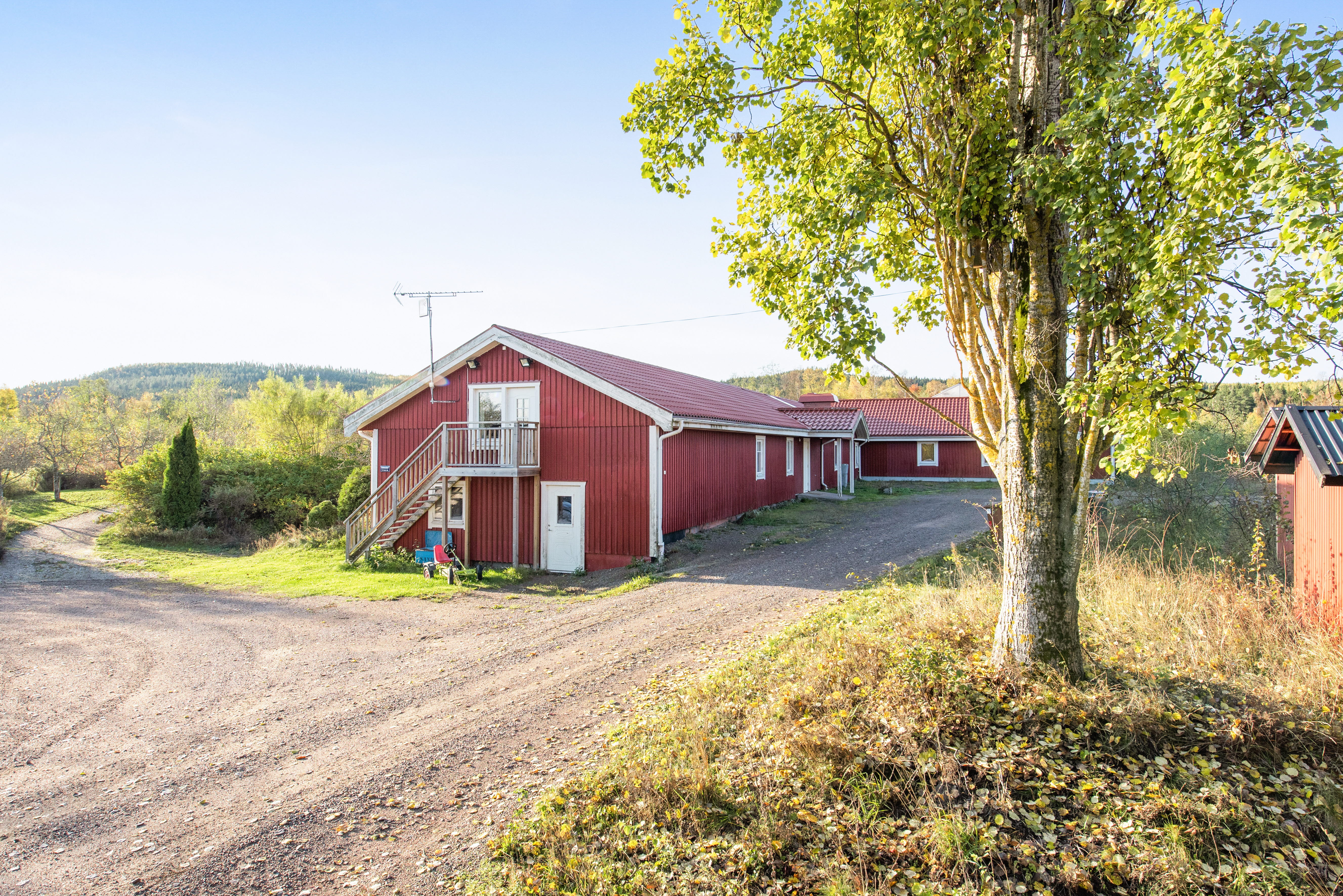 A house on the side of a dirt road