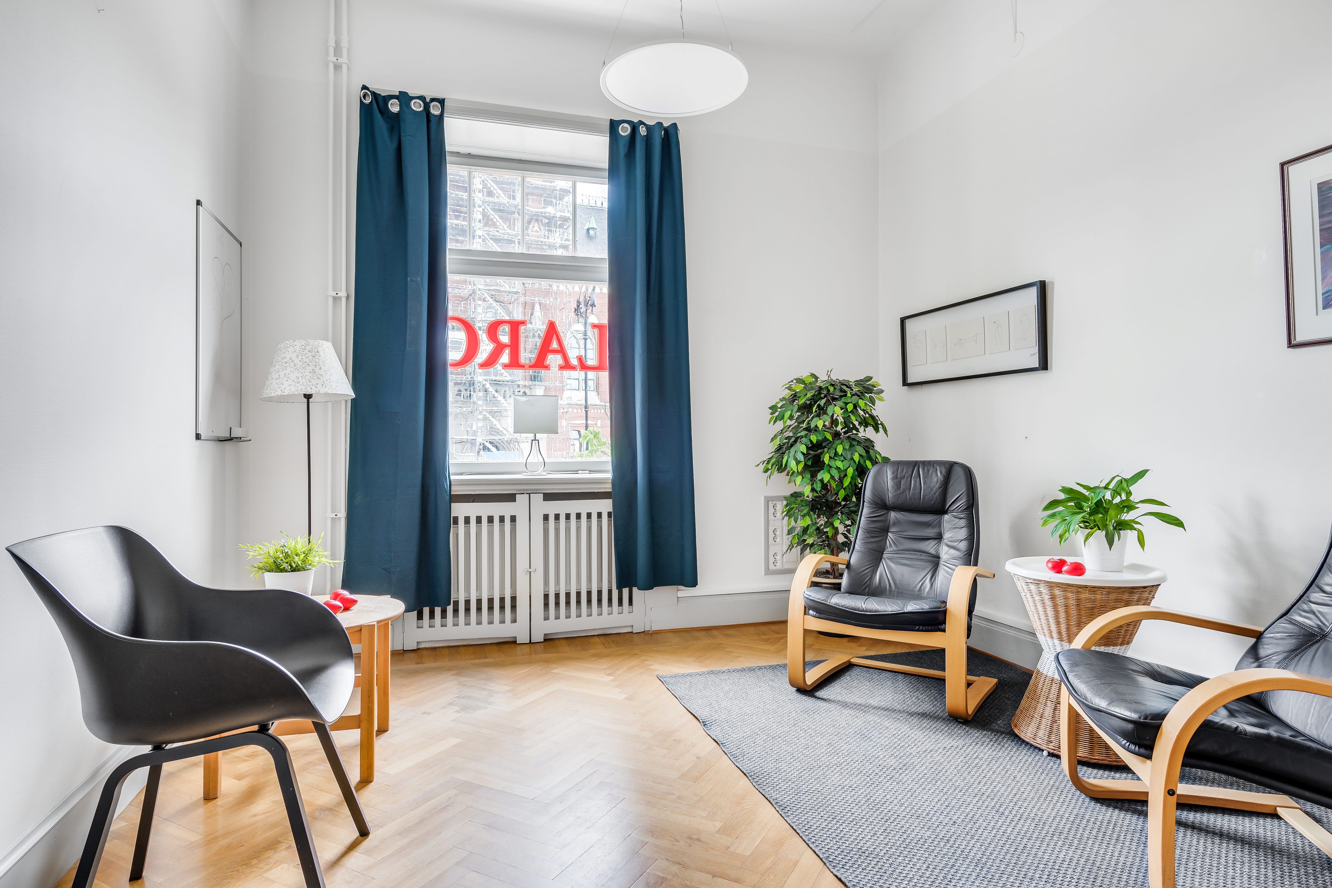 A living room filled with furniture and a large window