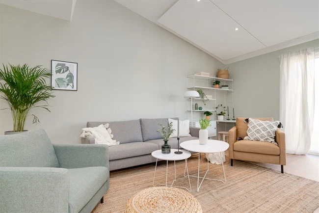 A living room filled with furniture and a fireplace