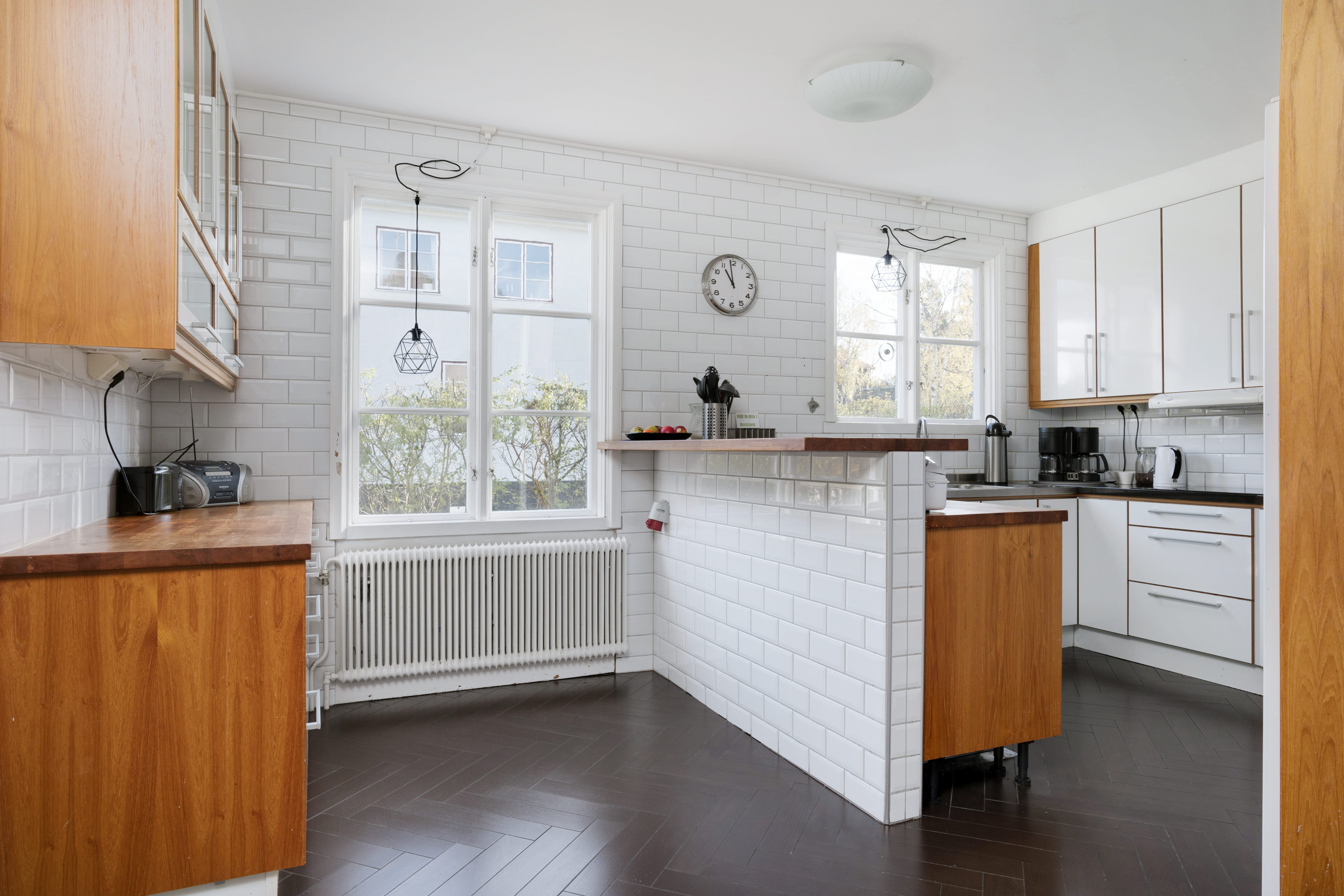 A kitchen with a sink and a window