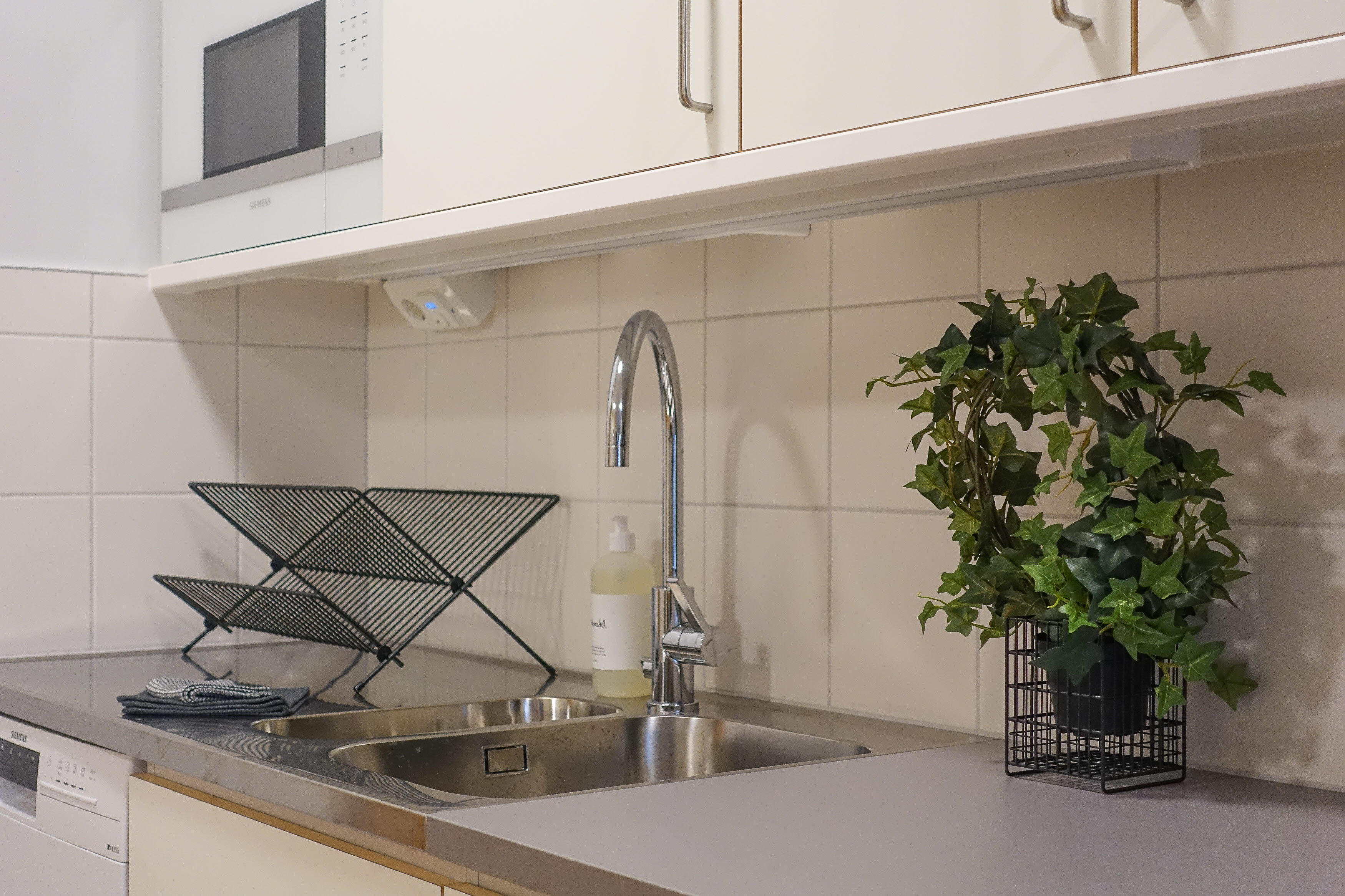 A kitchen with a stove and a sink