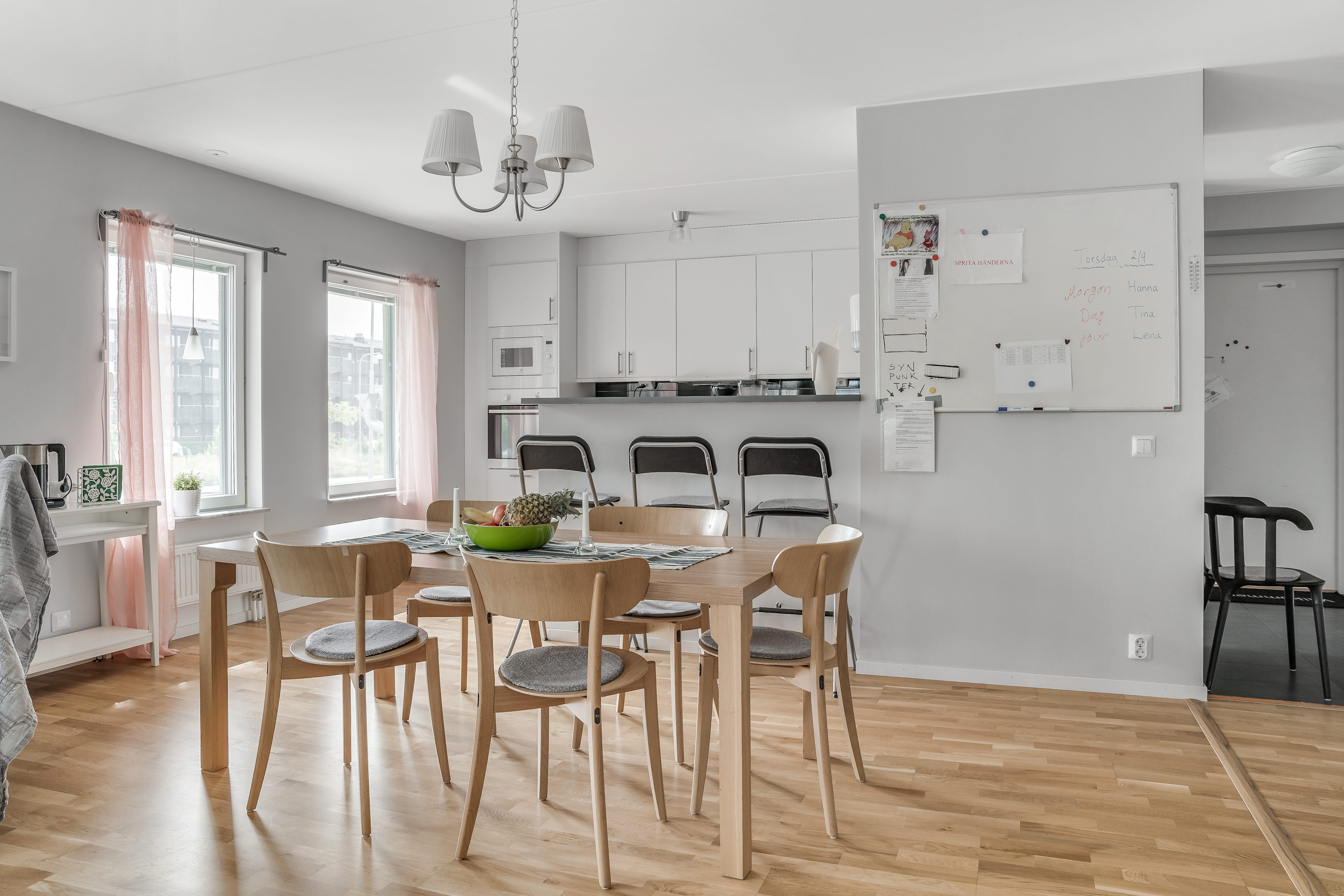 A kitchen with a dining room table