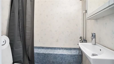 A shower that has a sink and a mirror