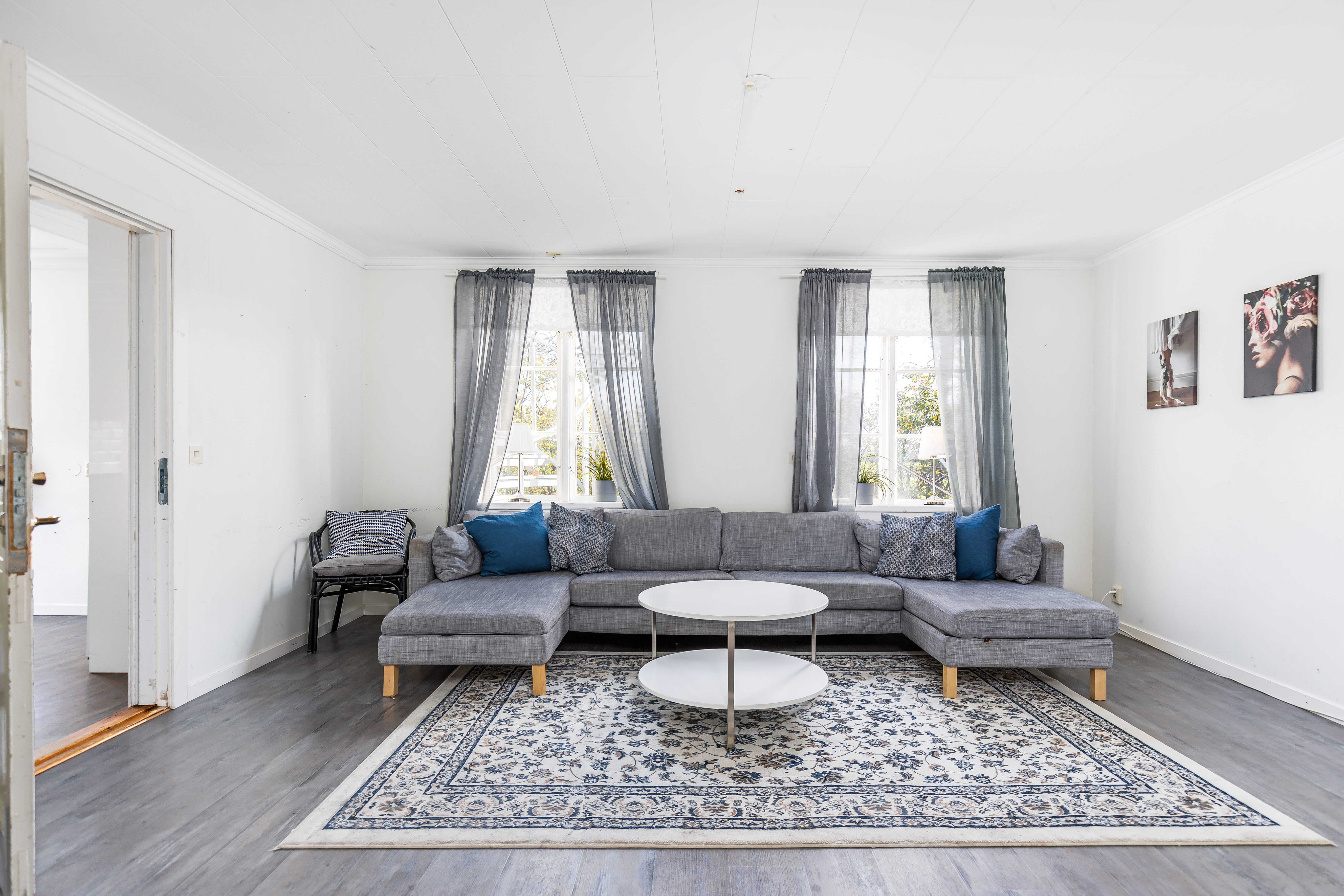 A living room filled with furniture and a large window