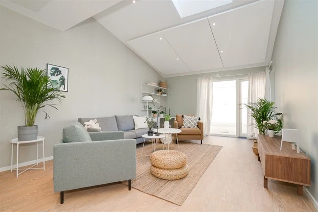 A living room filled with furniture and vase