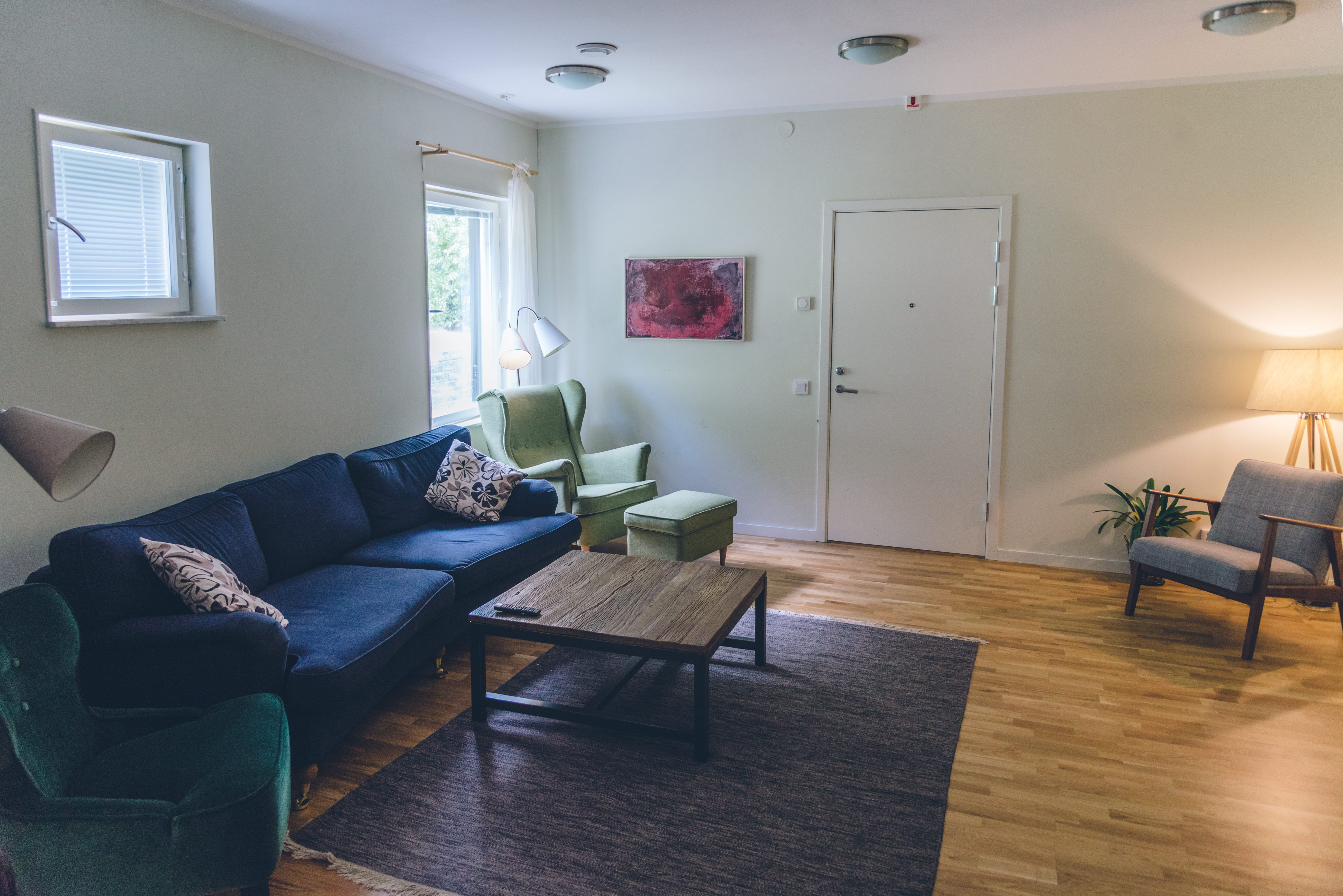 A living room filled with furniture and a large window